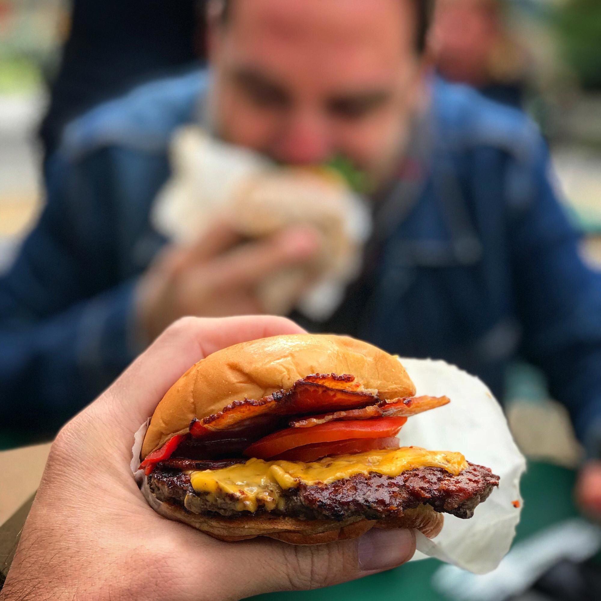 Why Family-Owned Fast Food Wins on Quality and Personal Touch - The Jubilee Juice & Grill Way 1 cropped hand of man holding burger in restaurant 9a3d25d4d81635cda69e