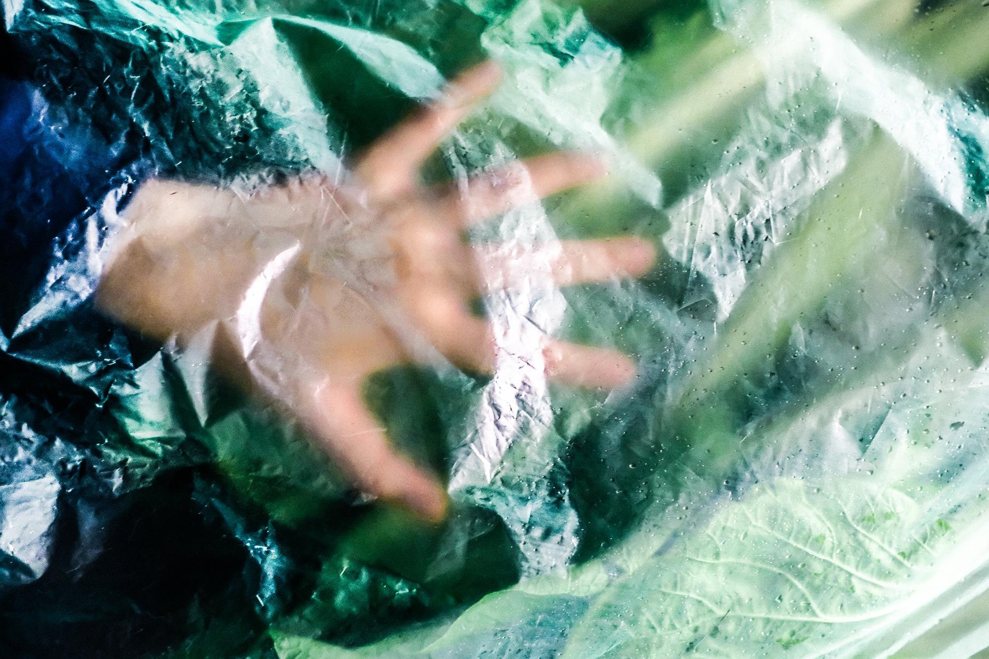 Cut Waste, Cut Costs: Tailored Plastic Solutions for Trade and DIY 3 cropped hand of person seen through plastic a6149a9d8ecd150610a7