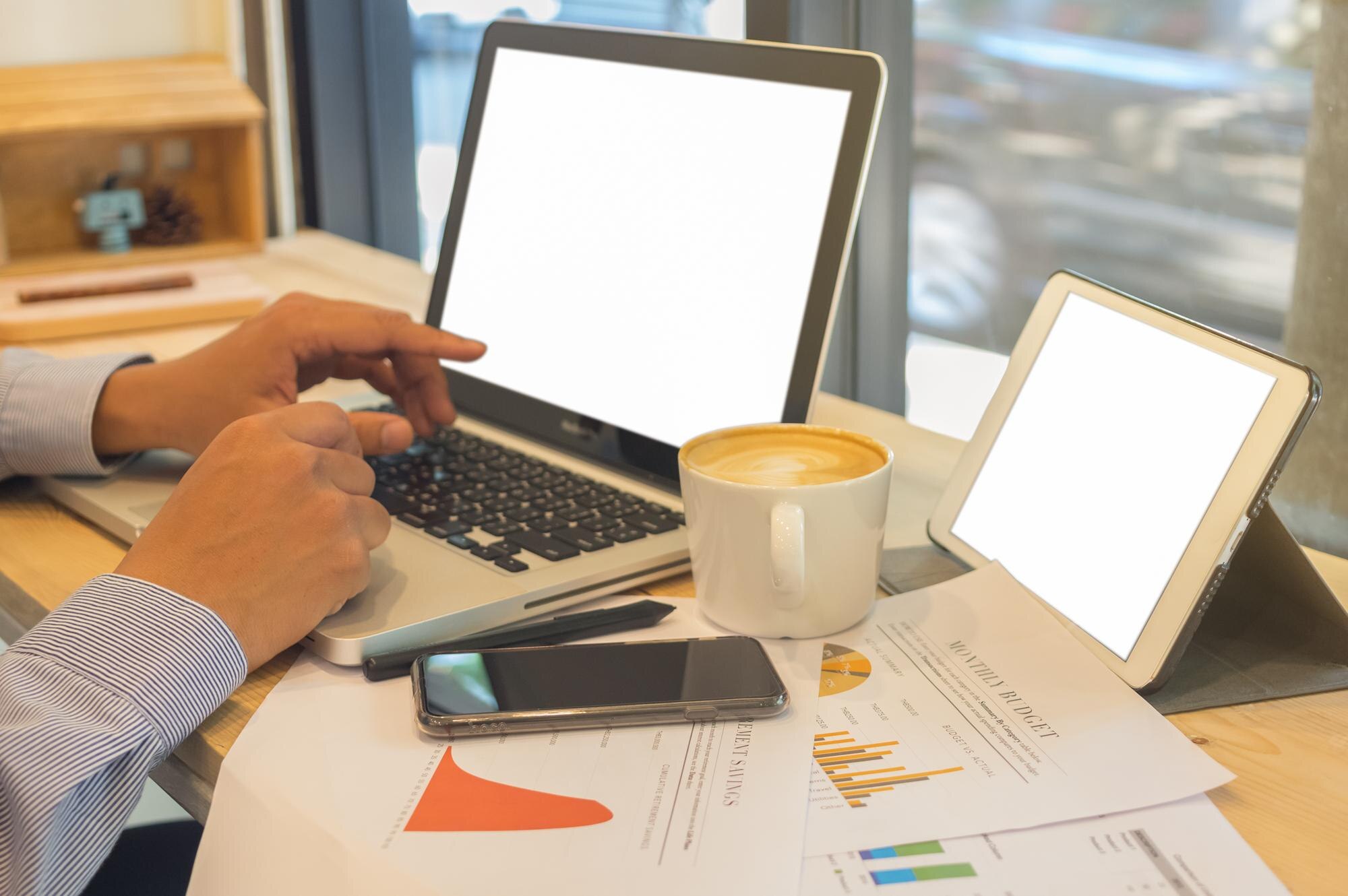 cropped hands of businessman using laptop on table e806a0105bcd8218f08f
