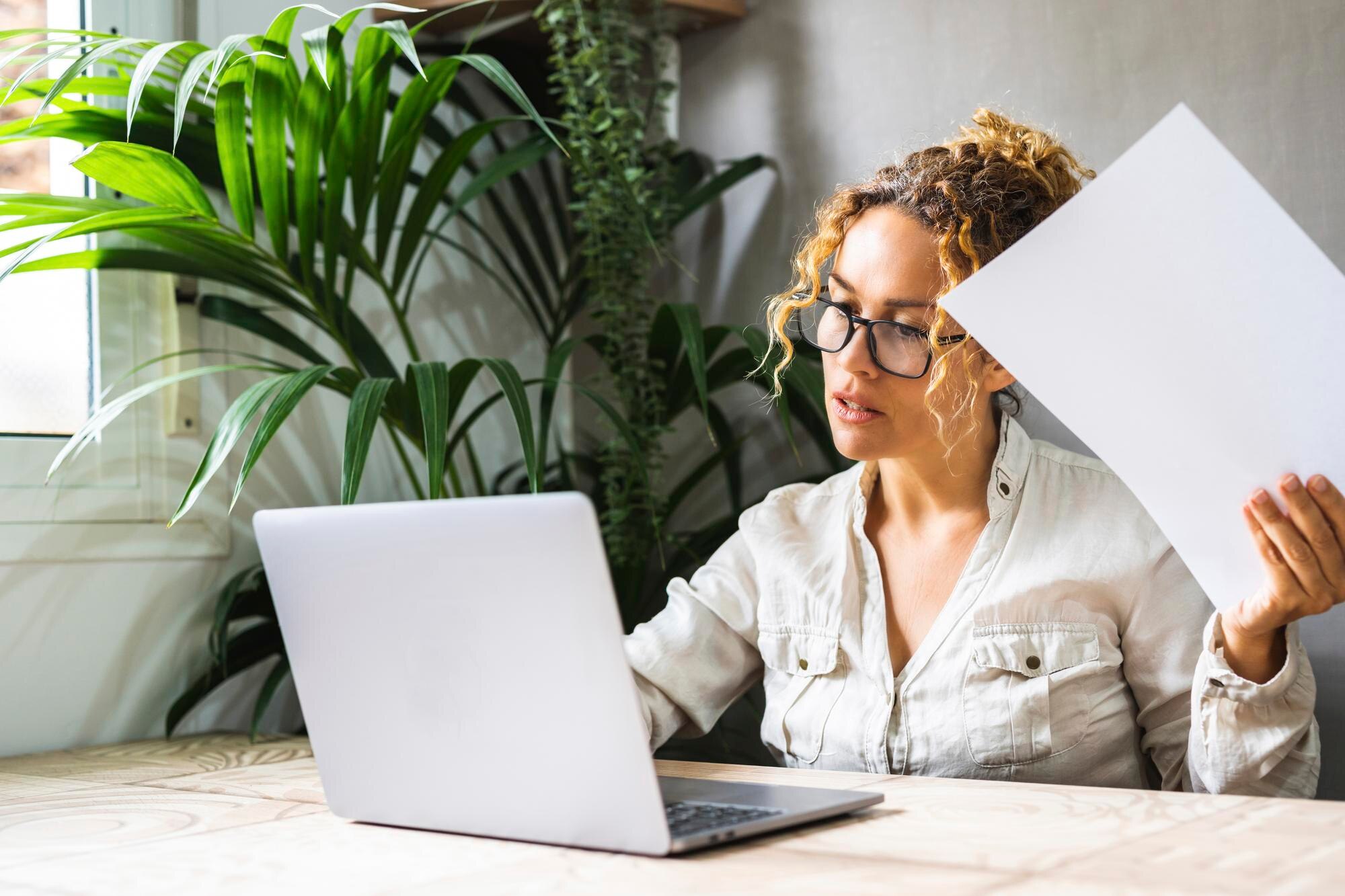 curly woman with glasses using laptop communicatin 383f9b138c1e5762dcbf