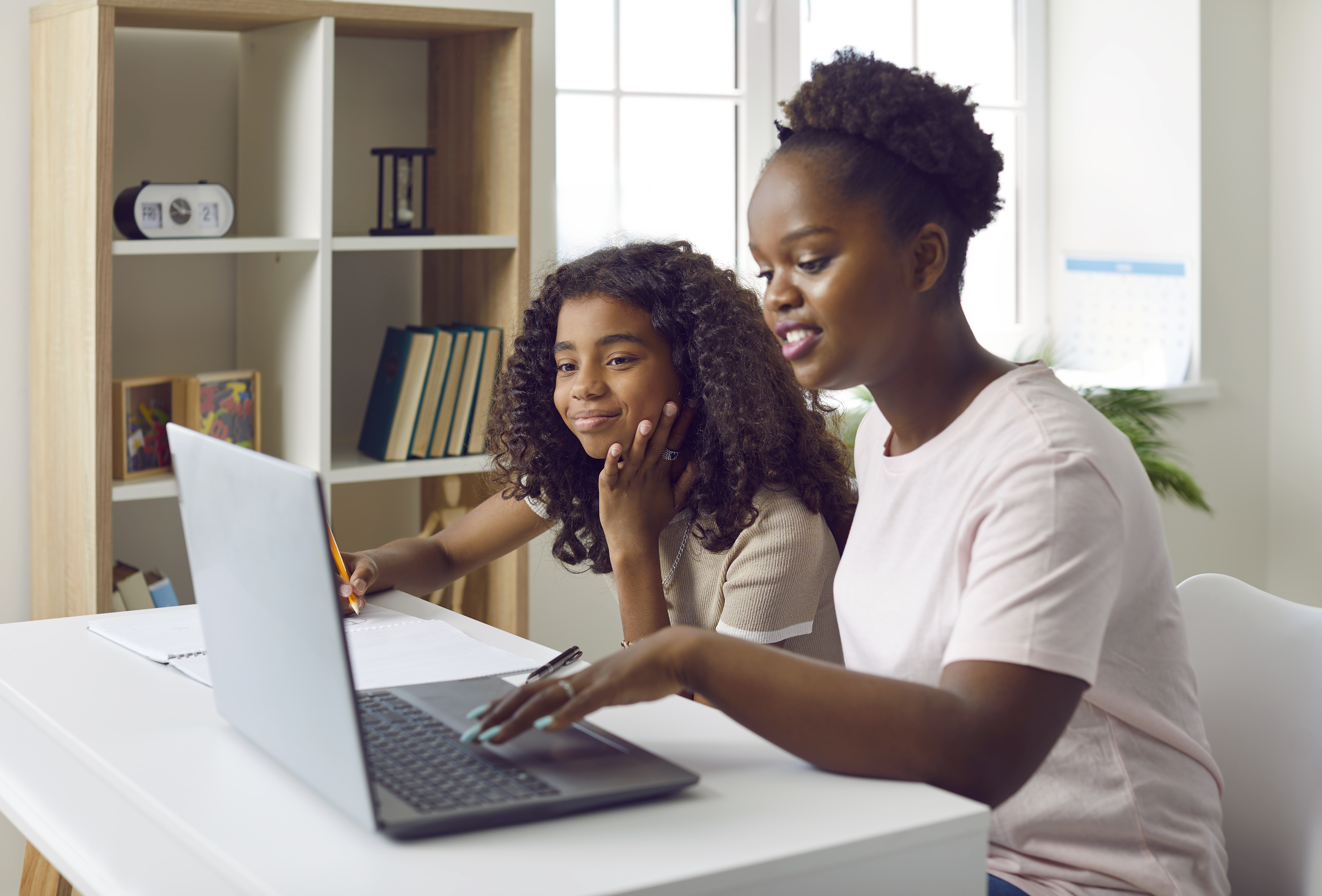 Dark Skinned Family Study Home At Table With Lapto 5d4e5a8d2582a2820a01