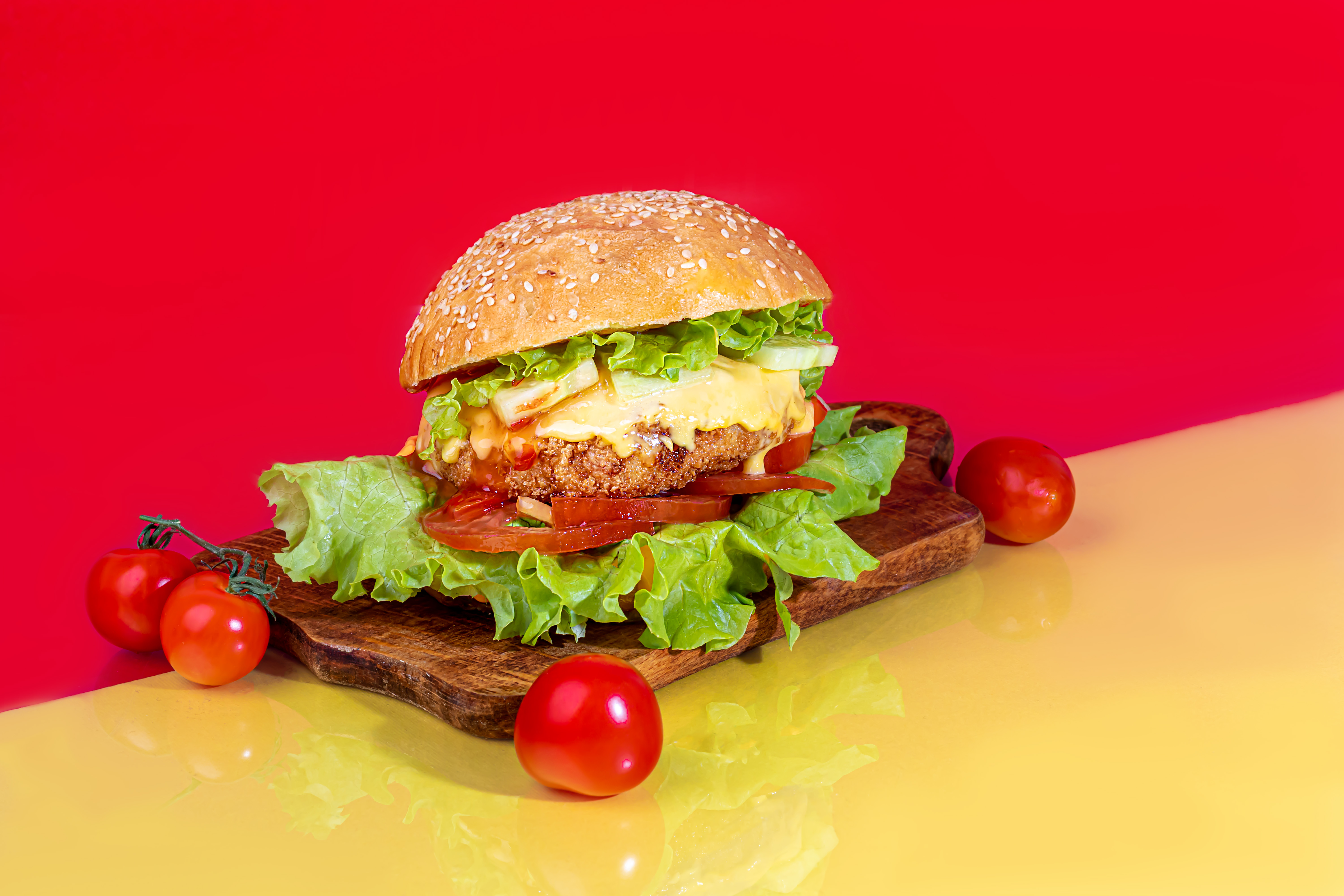 delicious burger on the board with cutlet tomatoe c83d1d364da2863f4b02