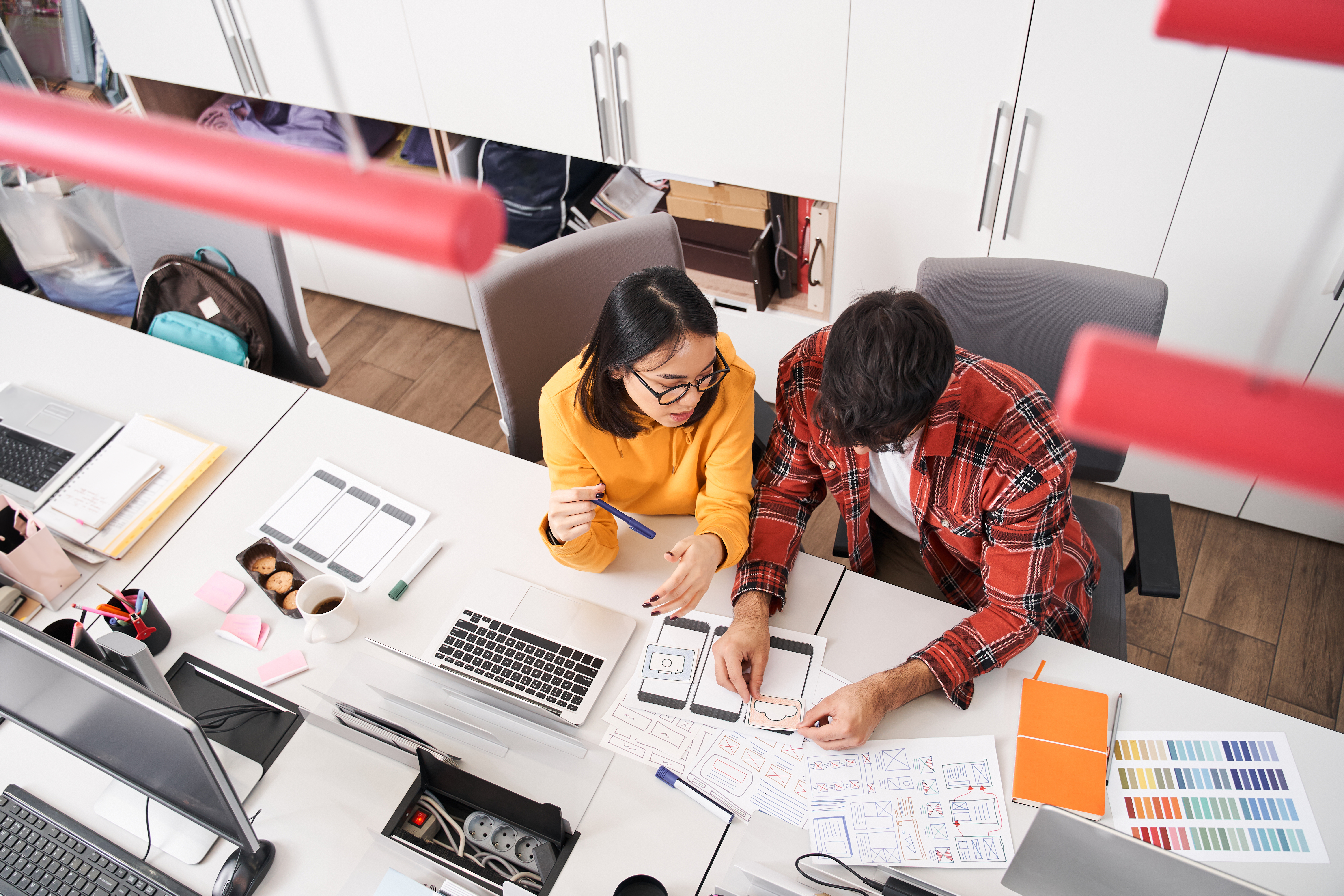 designer holding paper with sample of design a3771ac3c3e88bb08a3c