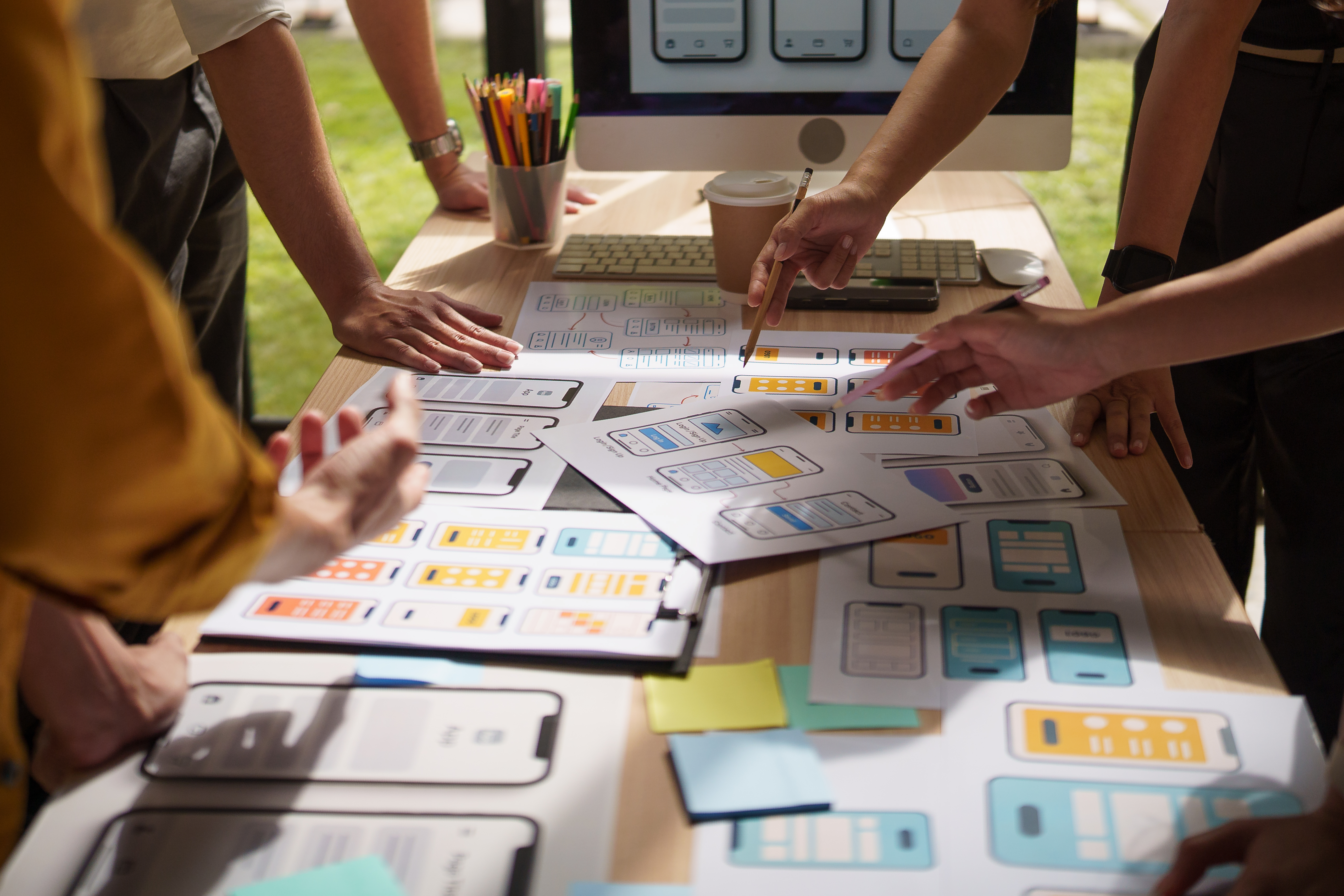 Affordable bespoke website design for small businesses: why monthly plans work best 2 designers brainstorming ux ui solutions with print 2ee3ad6658de21189c19