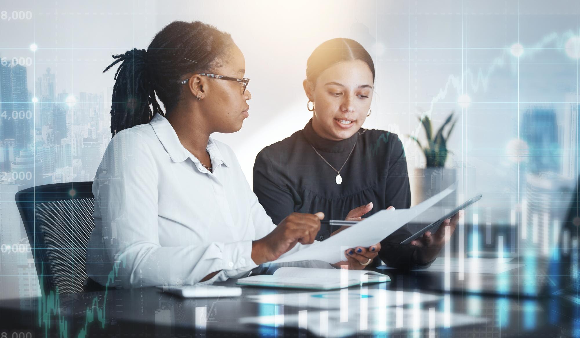 Commercial real estate partners collaborating on digital loan documents