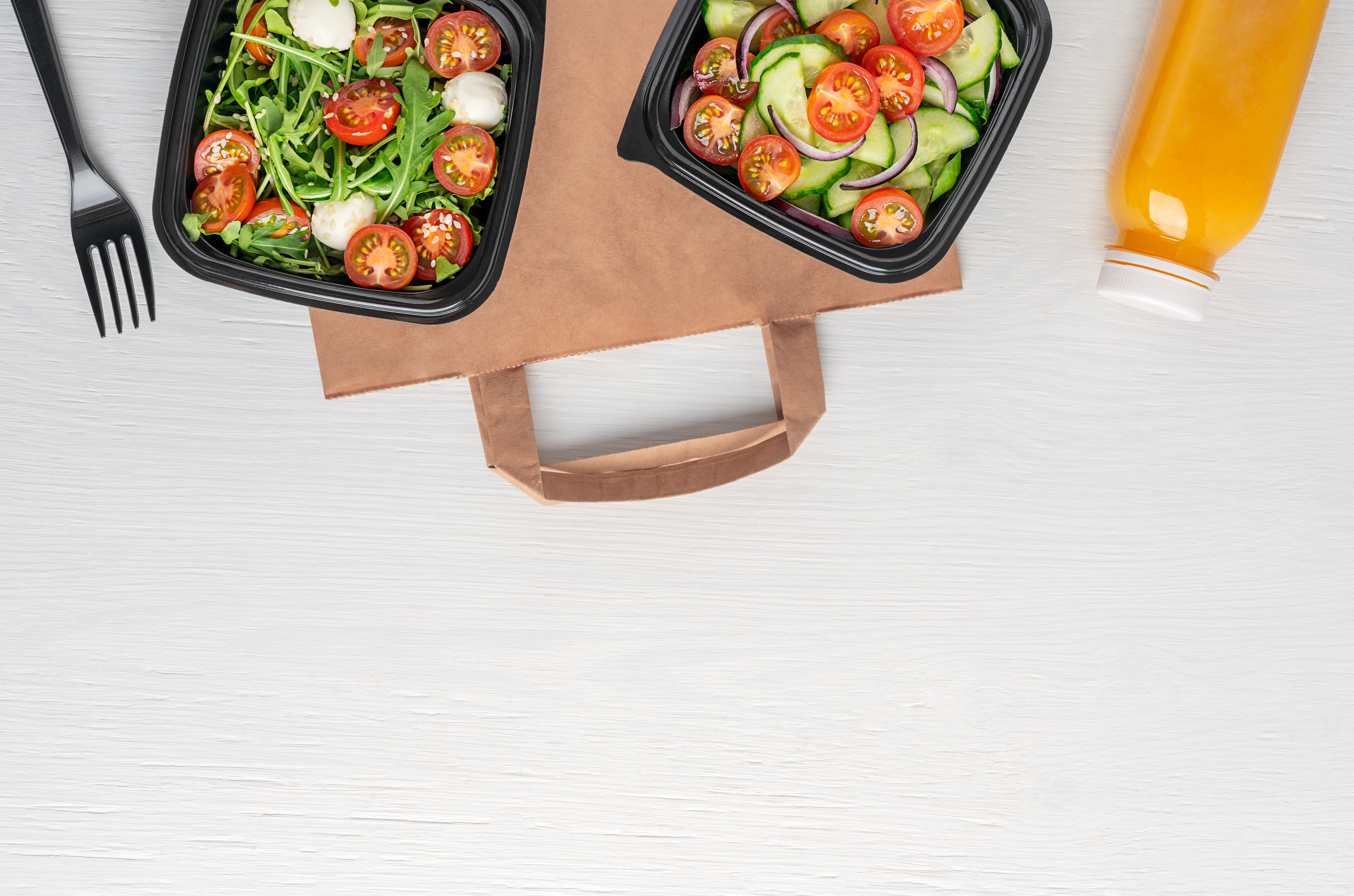 directly above view of paper bag with vegan salads 352a8fef9b351bcaf000