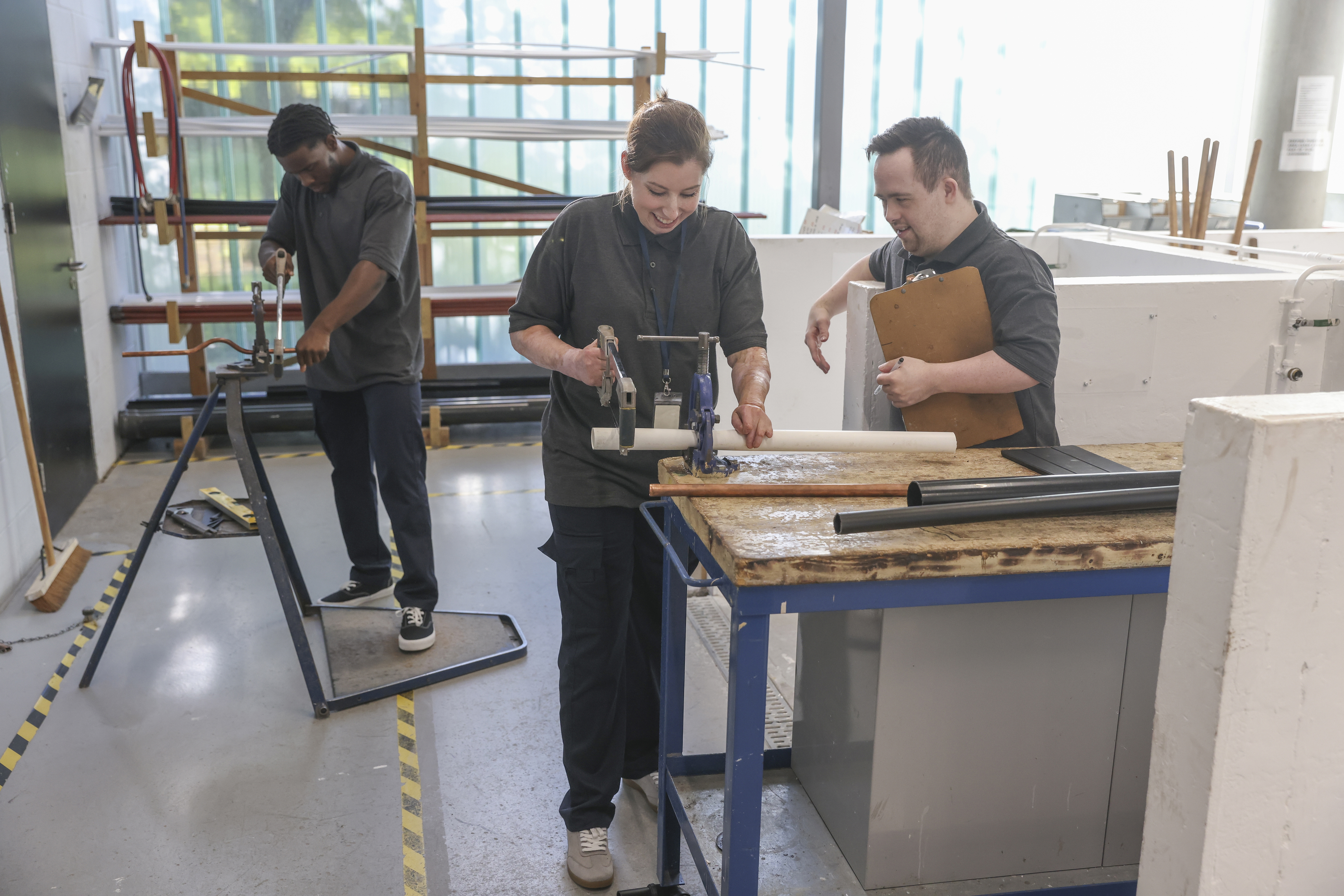 From Sketch to Finished Part: The Custom Plastic Fabrication Process at Plastic Online 3 disabled men and woman at workshop 0aa52963ba803018f3b3