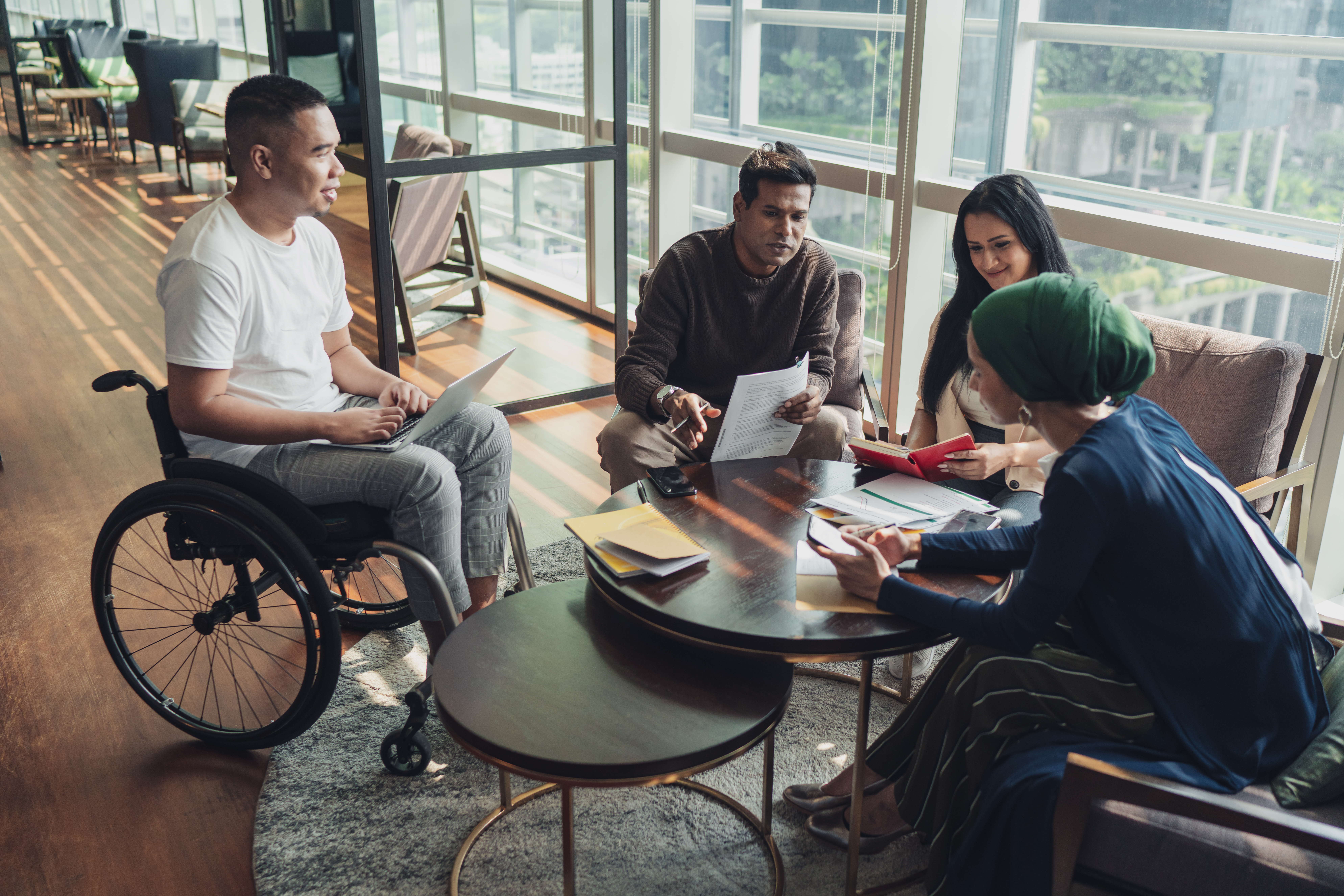 Diverse Asian Business Team In Discussion F0E103F0526F00Fcedb2