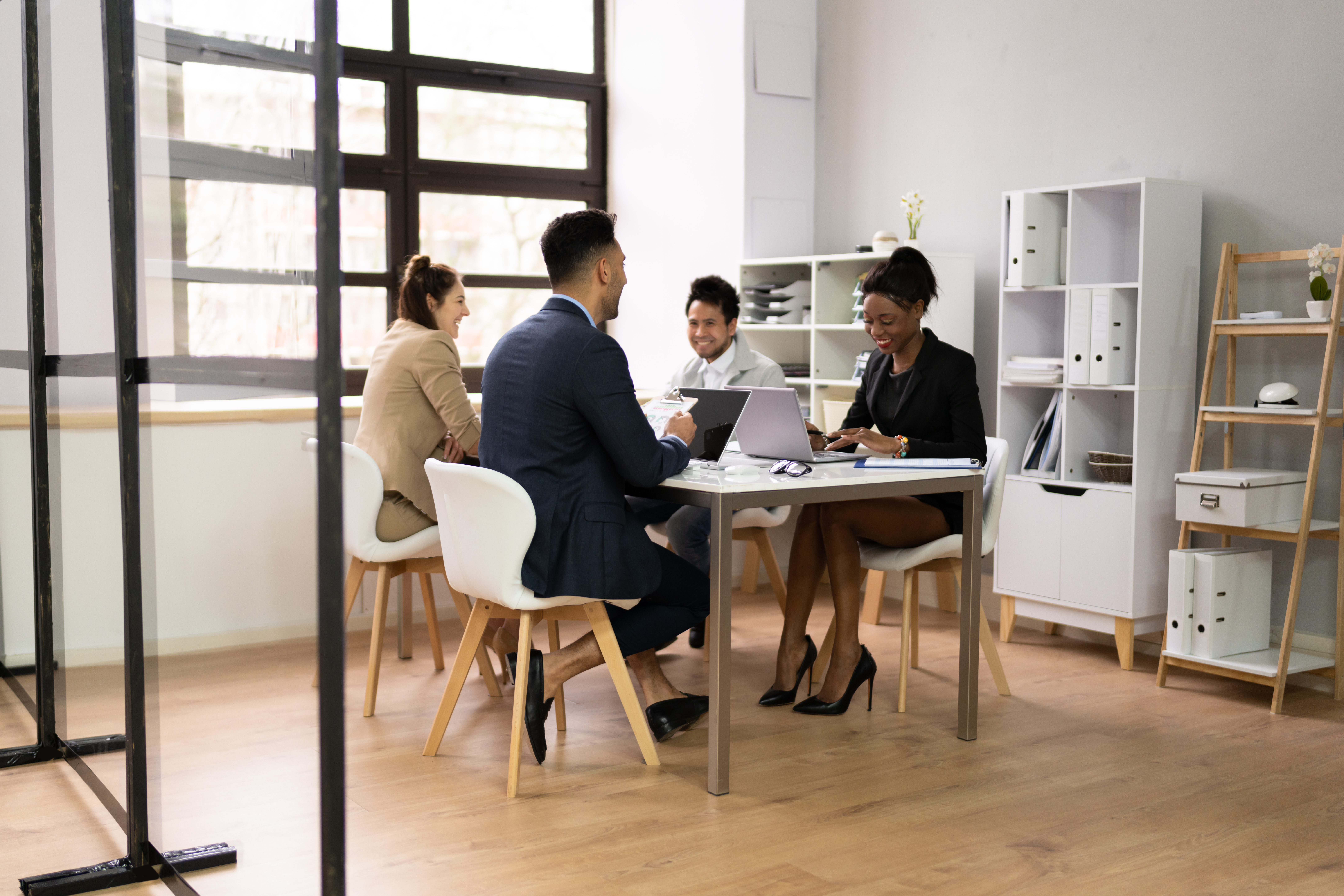 Unlocking the Power of Negotiation: Protect Your Margins, Build Lasting Value 2 diverse business people discussions in office 7c8198decd7cf1090139
