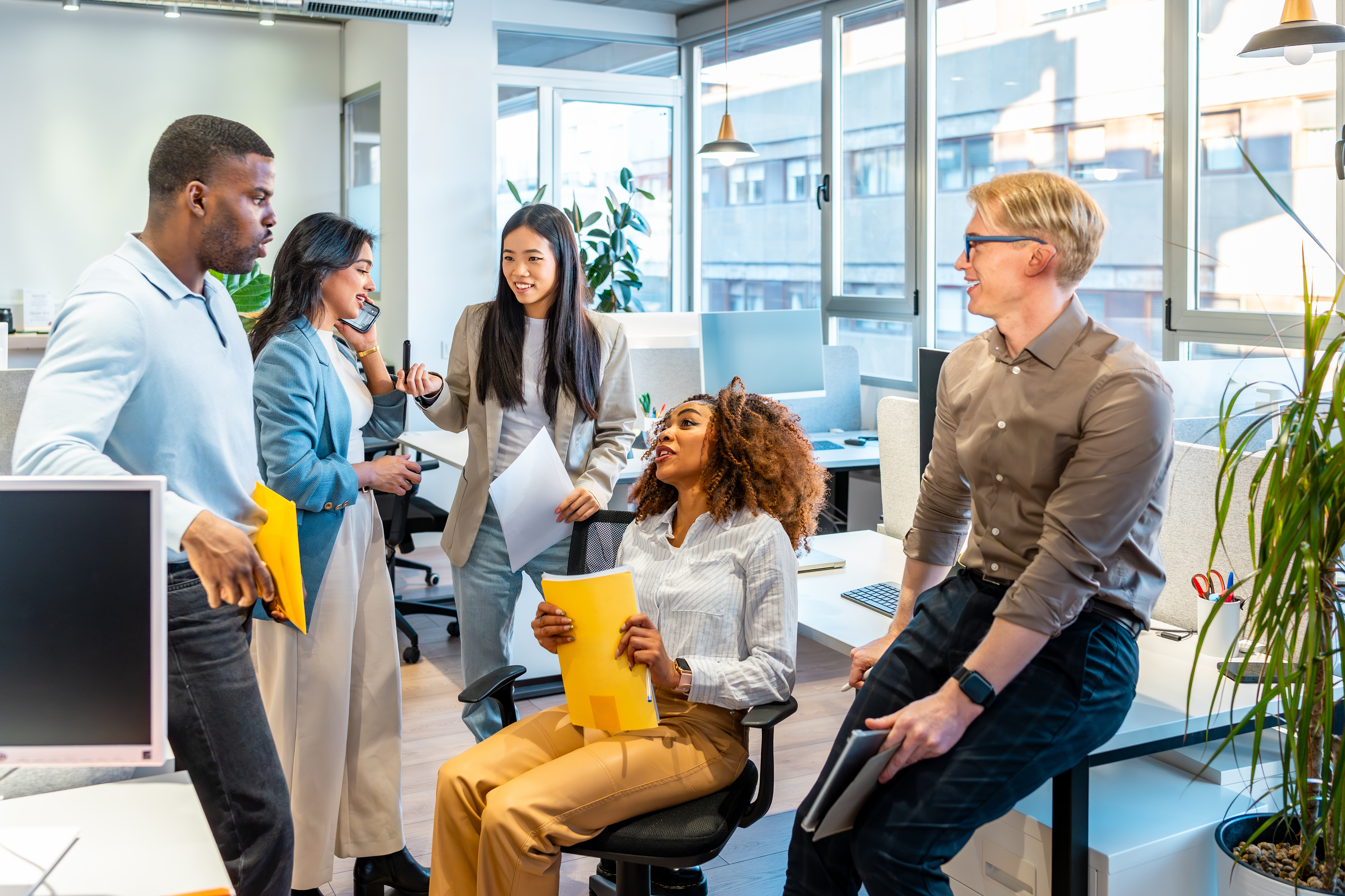 diverse business team collaborating on project in f822808439adb2a61af8