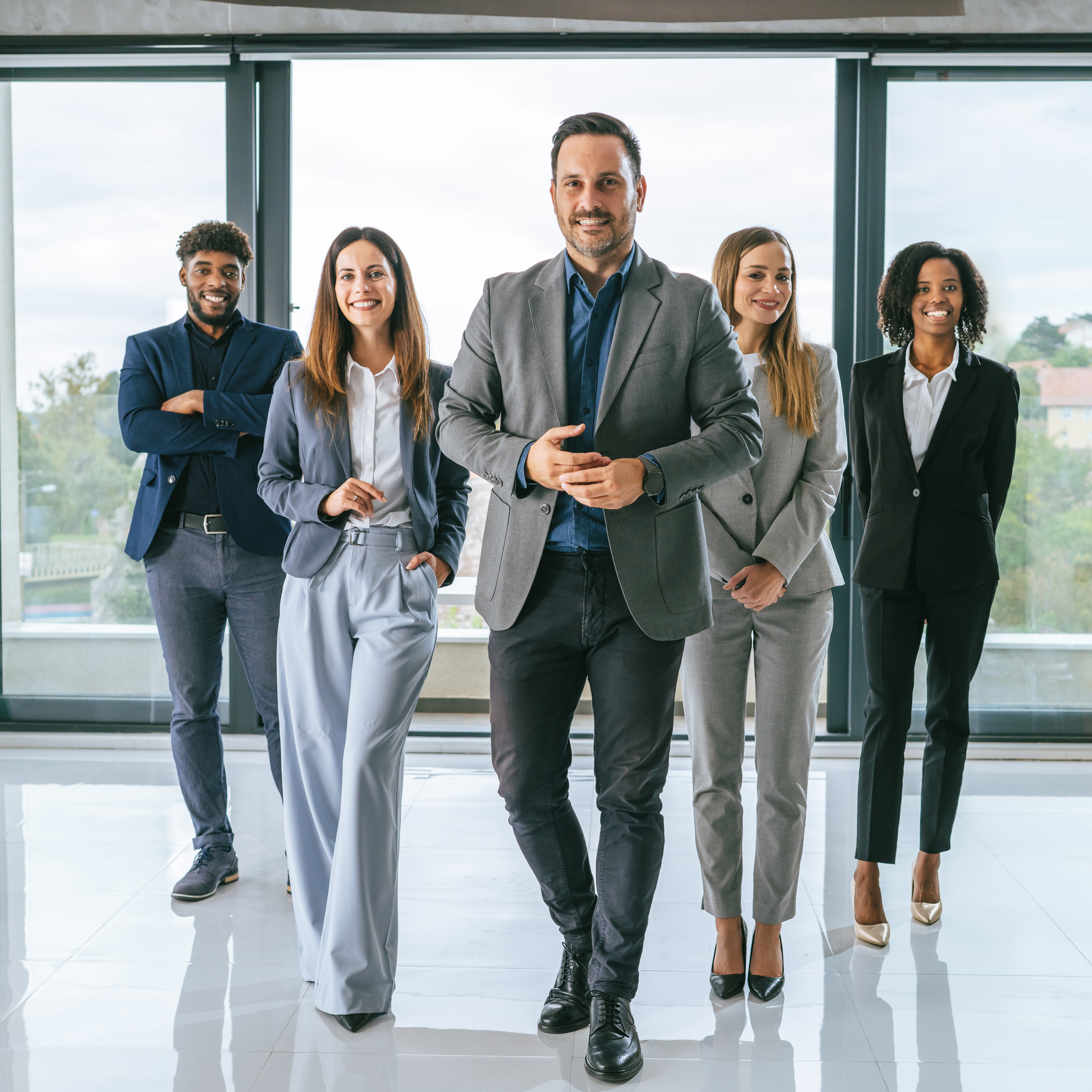 diverse business team walking towards camera in of ba7898827a1285ad7fb2