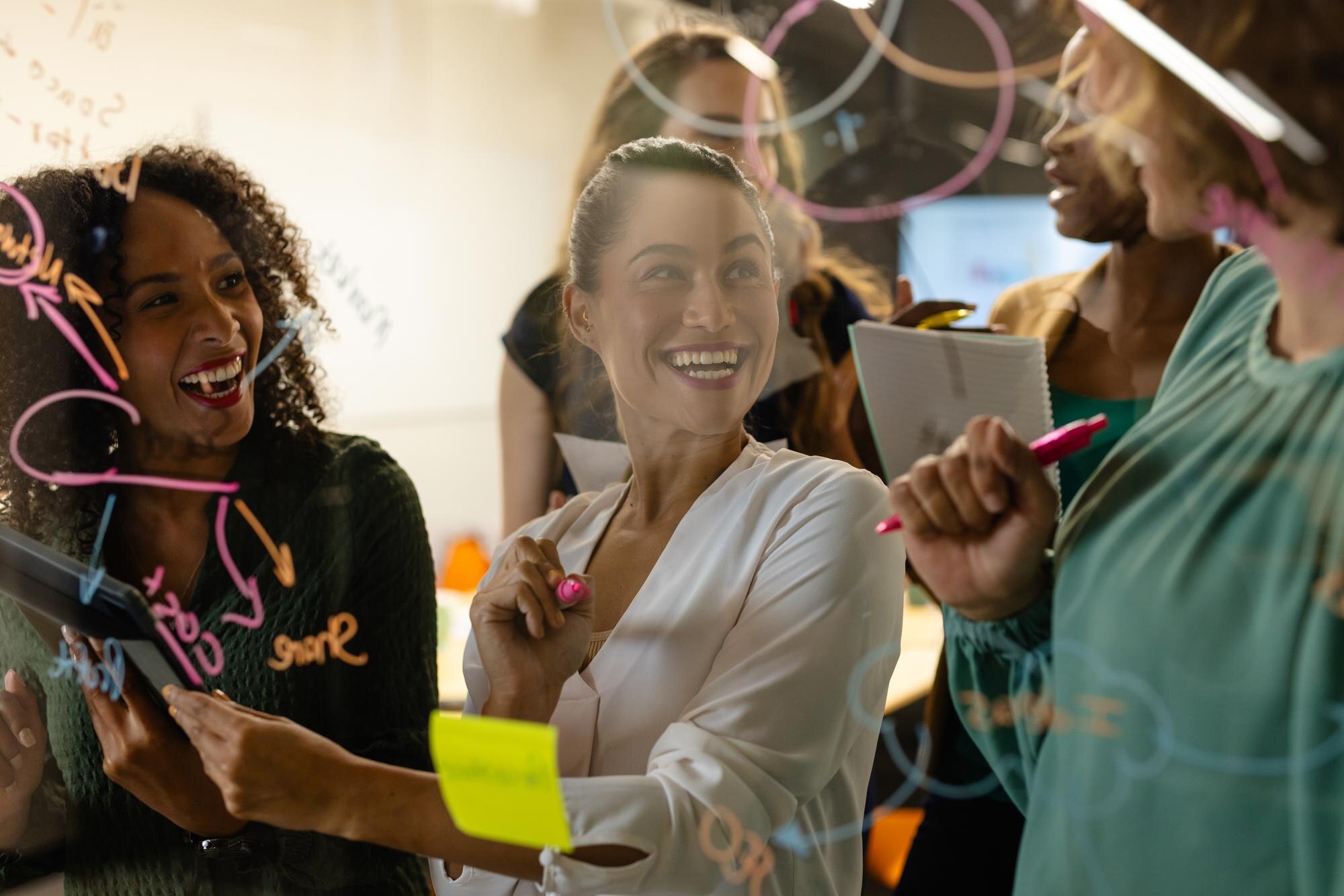 diverse creative female colleagues in discussion b 2b5fd37a8eb3eeb140b8
