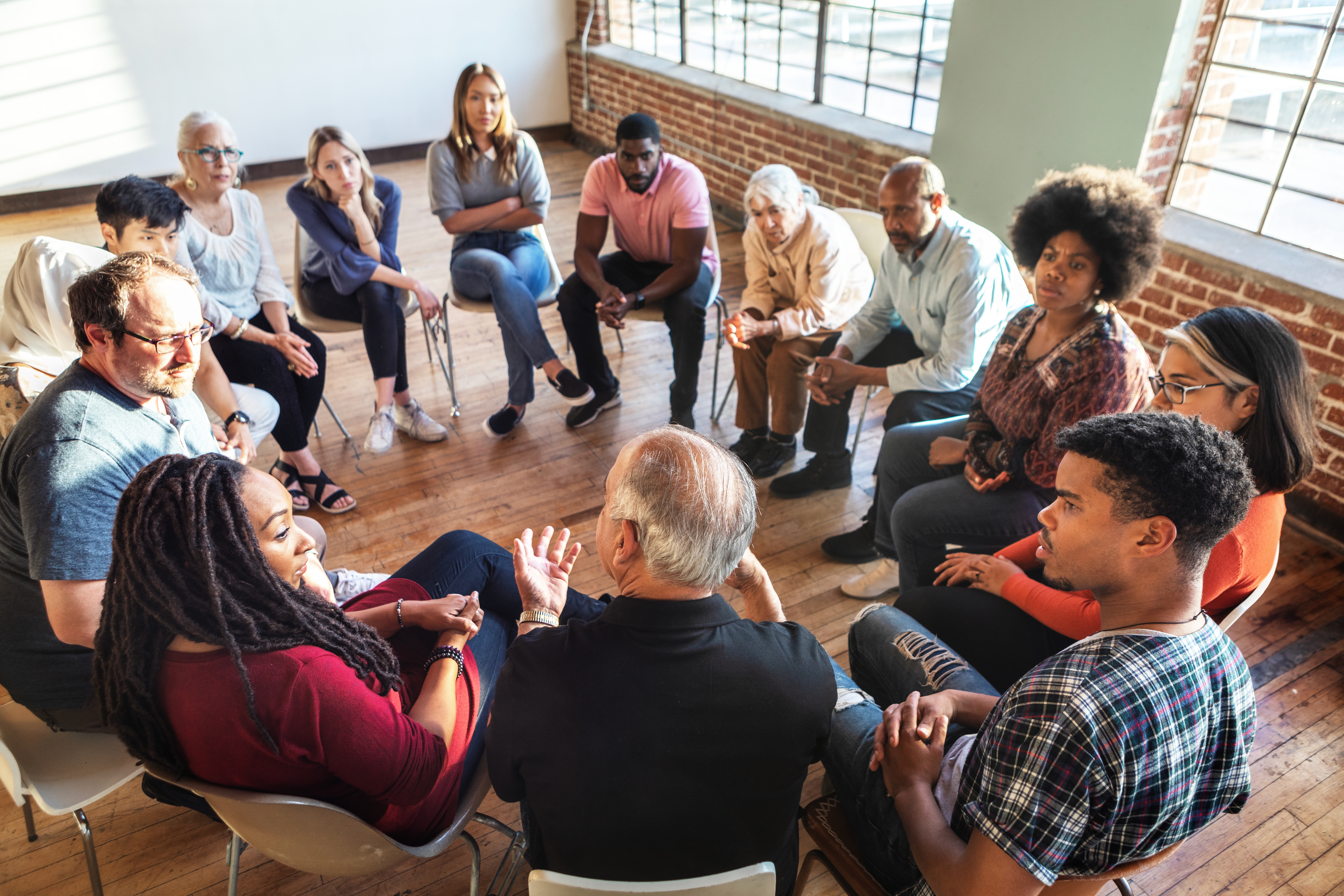 Strength in Numbers: How Community Support Can Conquer Self-Doubt Diverse Group In A Circle Discussing In A Bright 90a6852822efb95891f1
