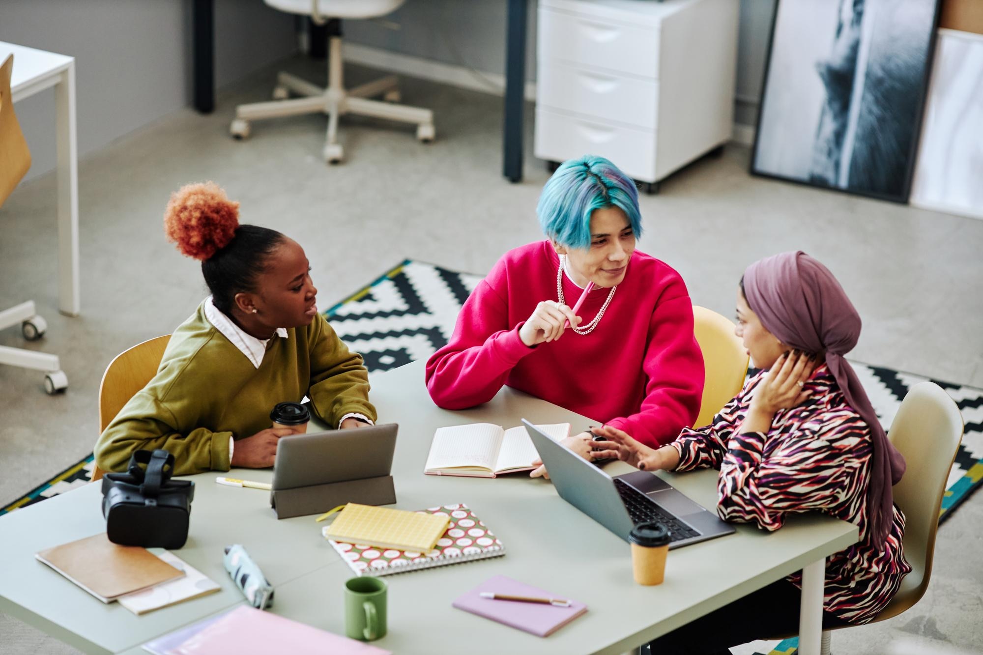 How to Build Your Travel Tribe from Scratch: A Guide for Aspiring Wanderpreneurs 1 diverse group of creative young people discussing 8bf75e45efe8b8f5b8c7