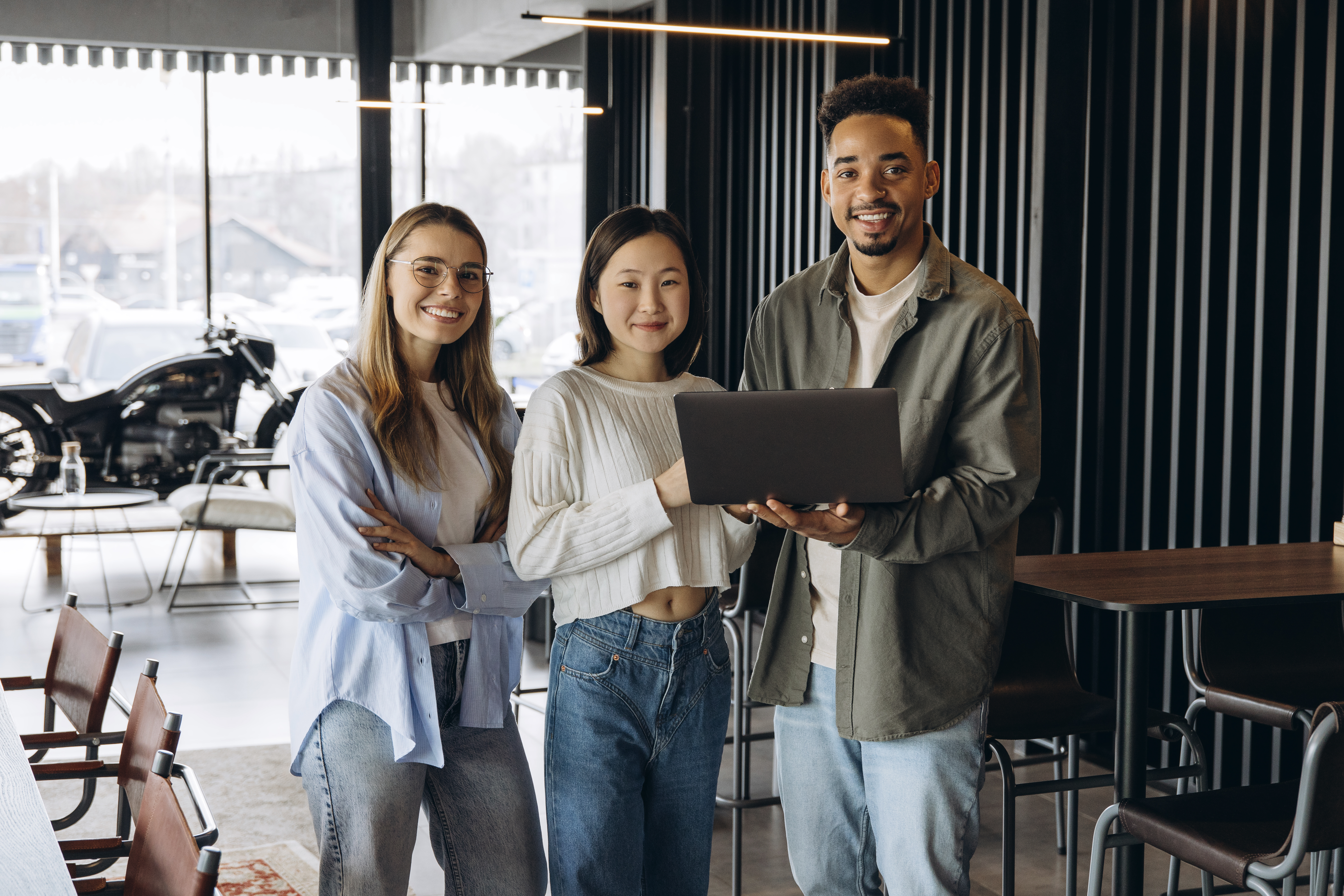 diverse startup team collaborating on laptop in mo 811008d89994897f82b0