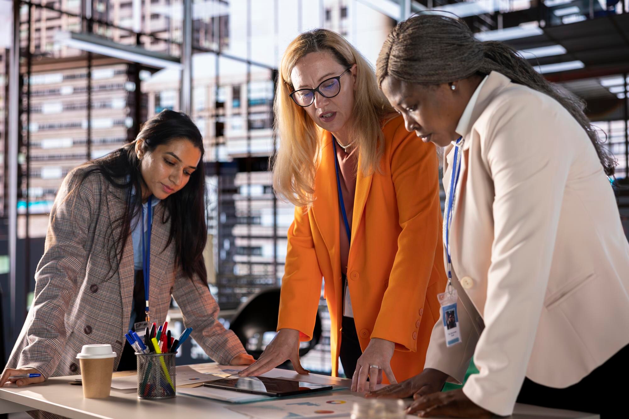 diverse team of empowered women executives discuss 1e073921d0419e5786ac