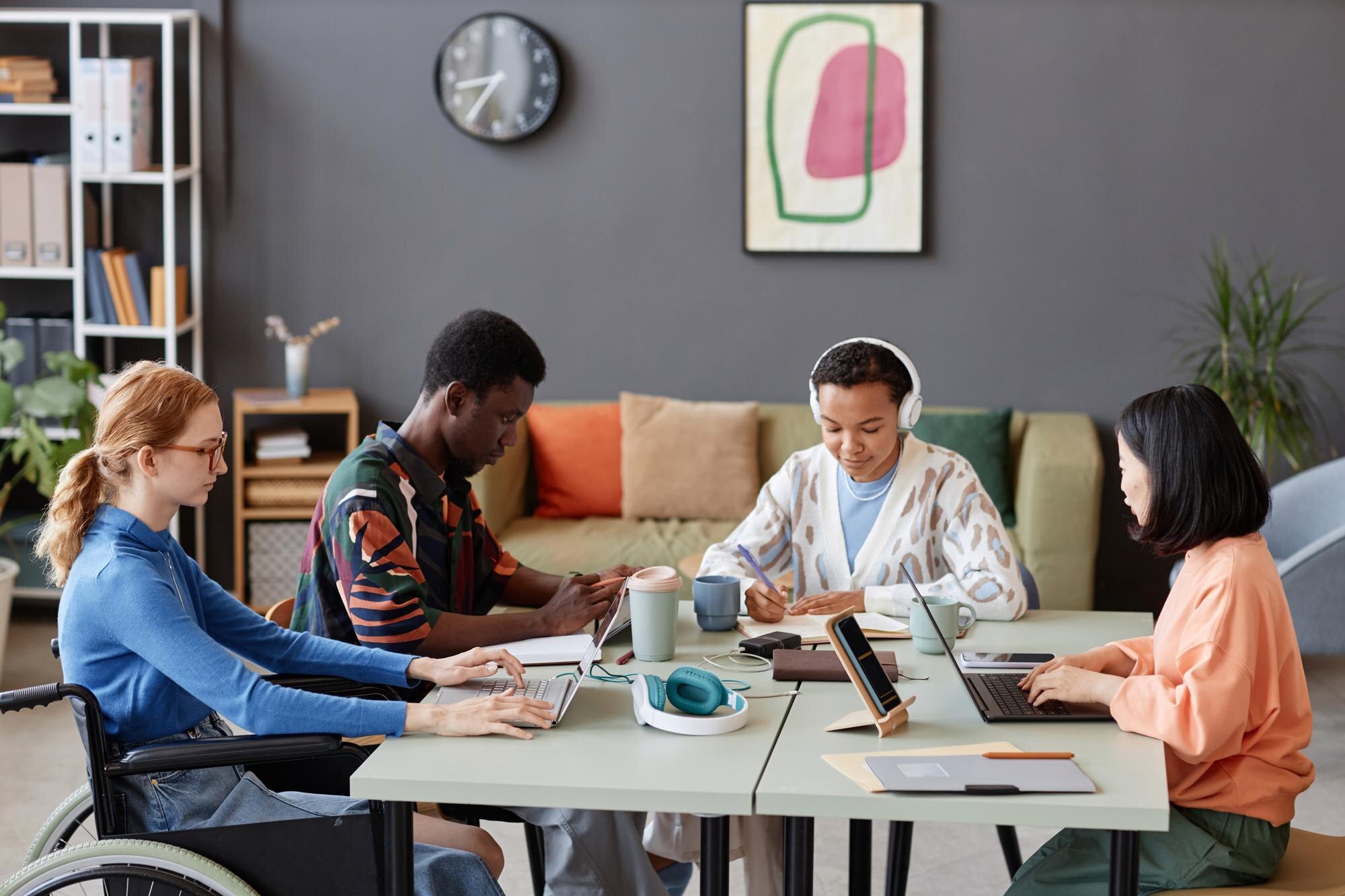 diverse young team working together at common tabl c0d8fee6ea35aca83709
