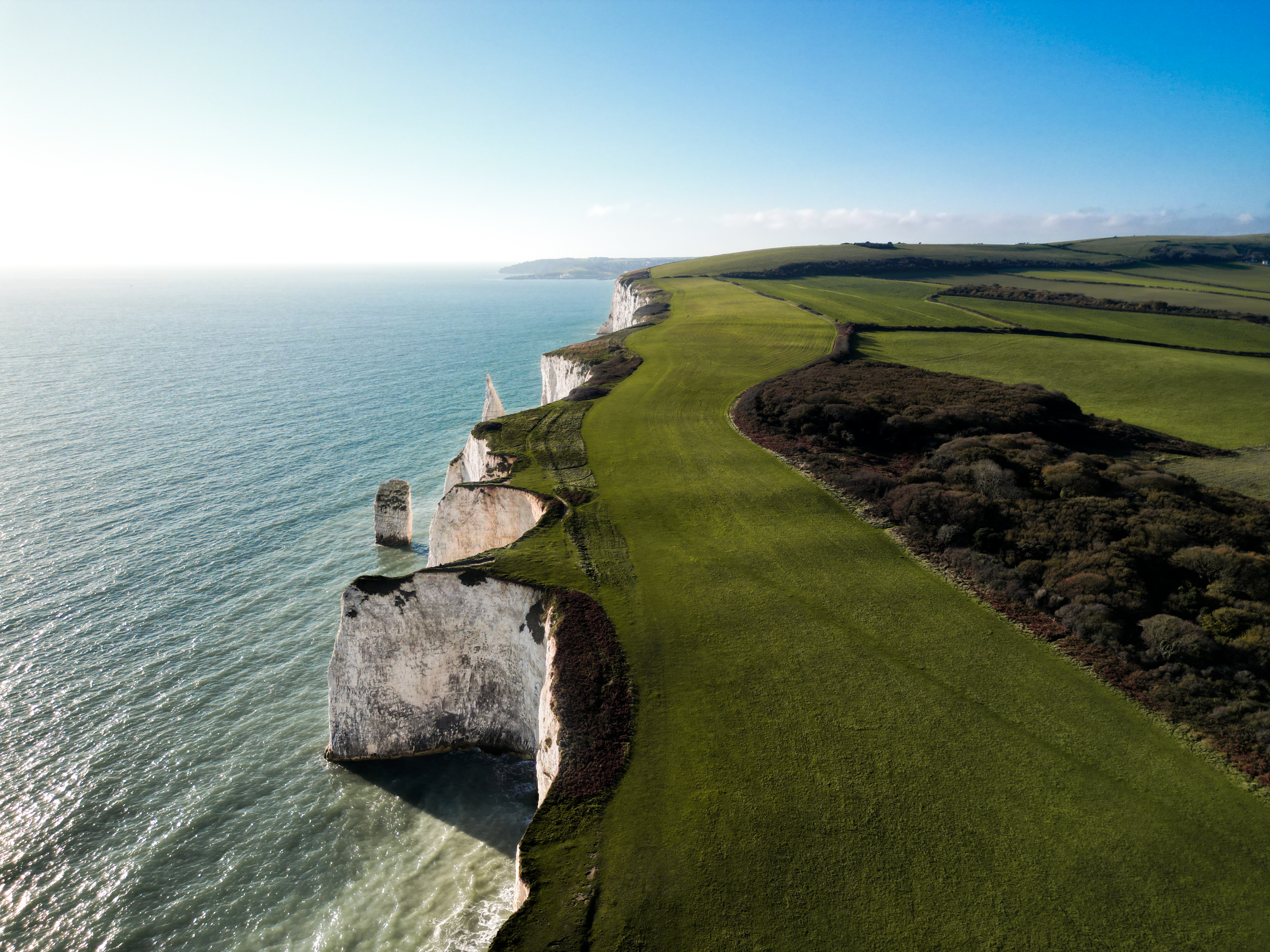 drone shot of cliff with great sun en green nature 60b74338af75f16ab2bf BTOURS