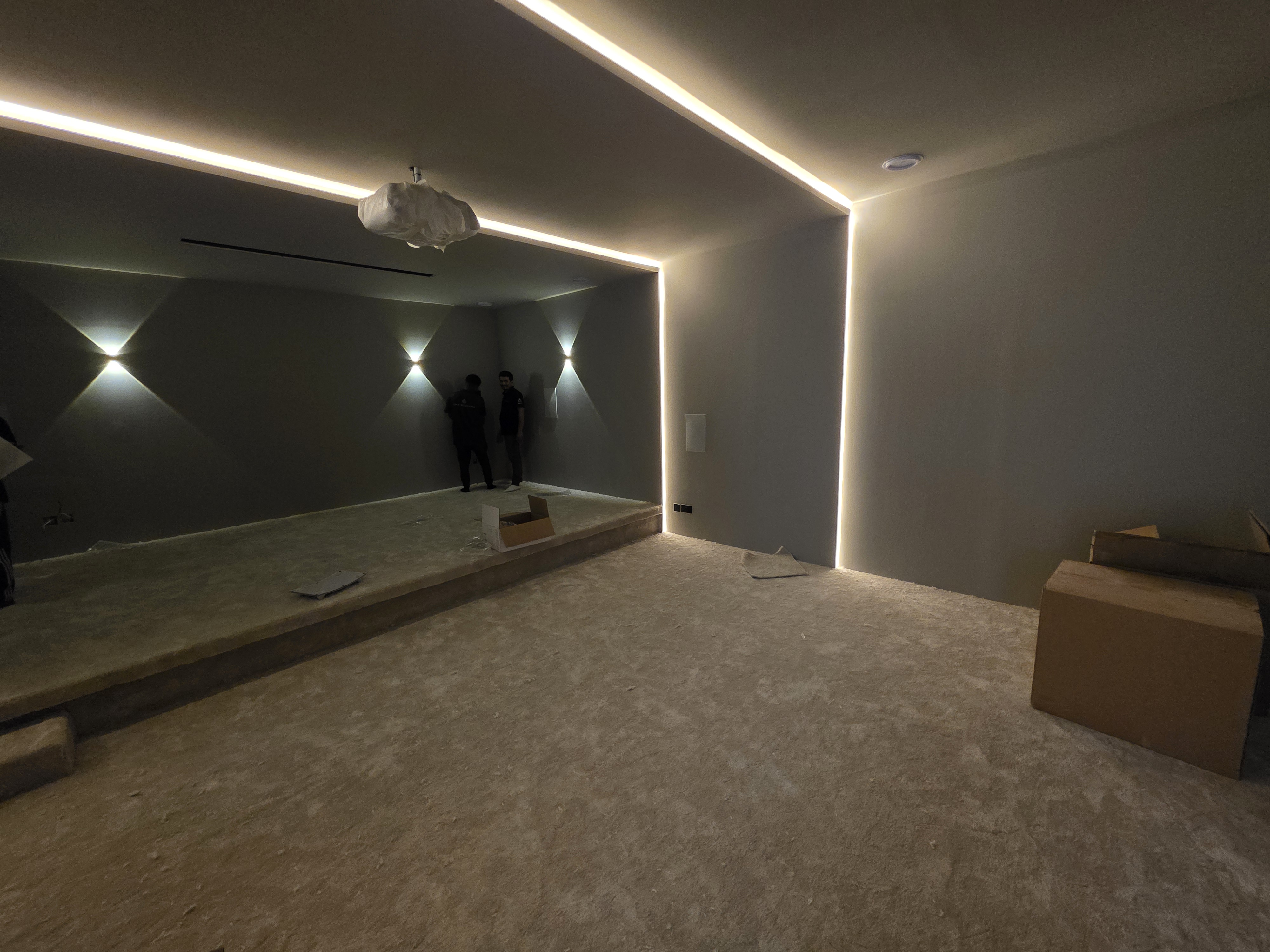 dubai hills villa cinema room side perspective with cove lighting before av fitout jpg 2e4a7ae3b752b8f1cb0b
