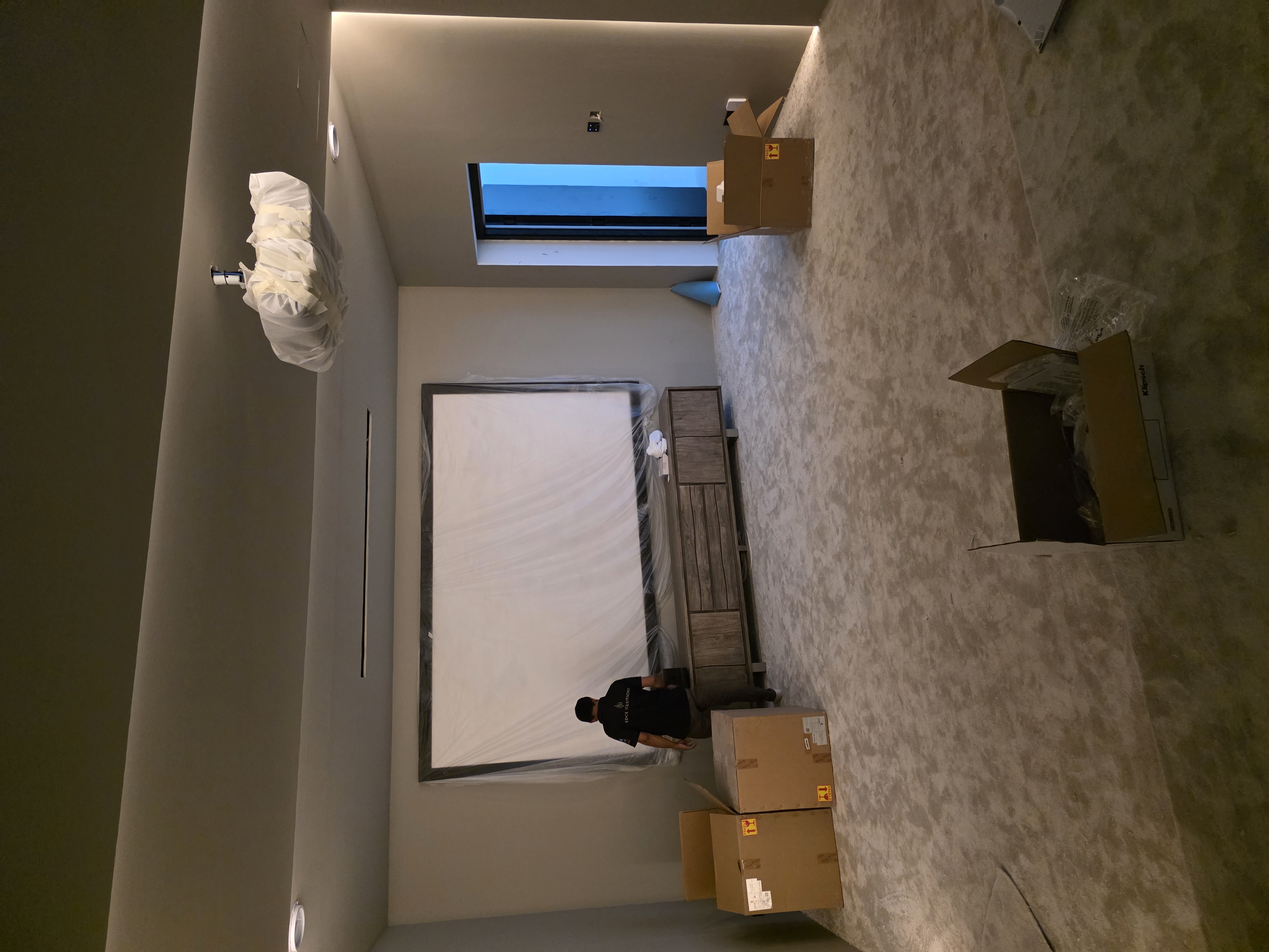 dubai hills villa cinema room side perspective with integrated lighting pre av installation jpg 3c1e0bc3a5cdfc8d60f7