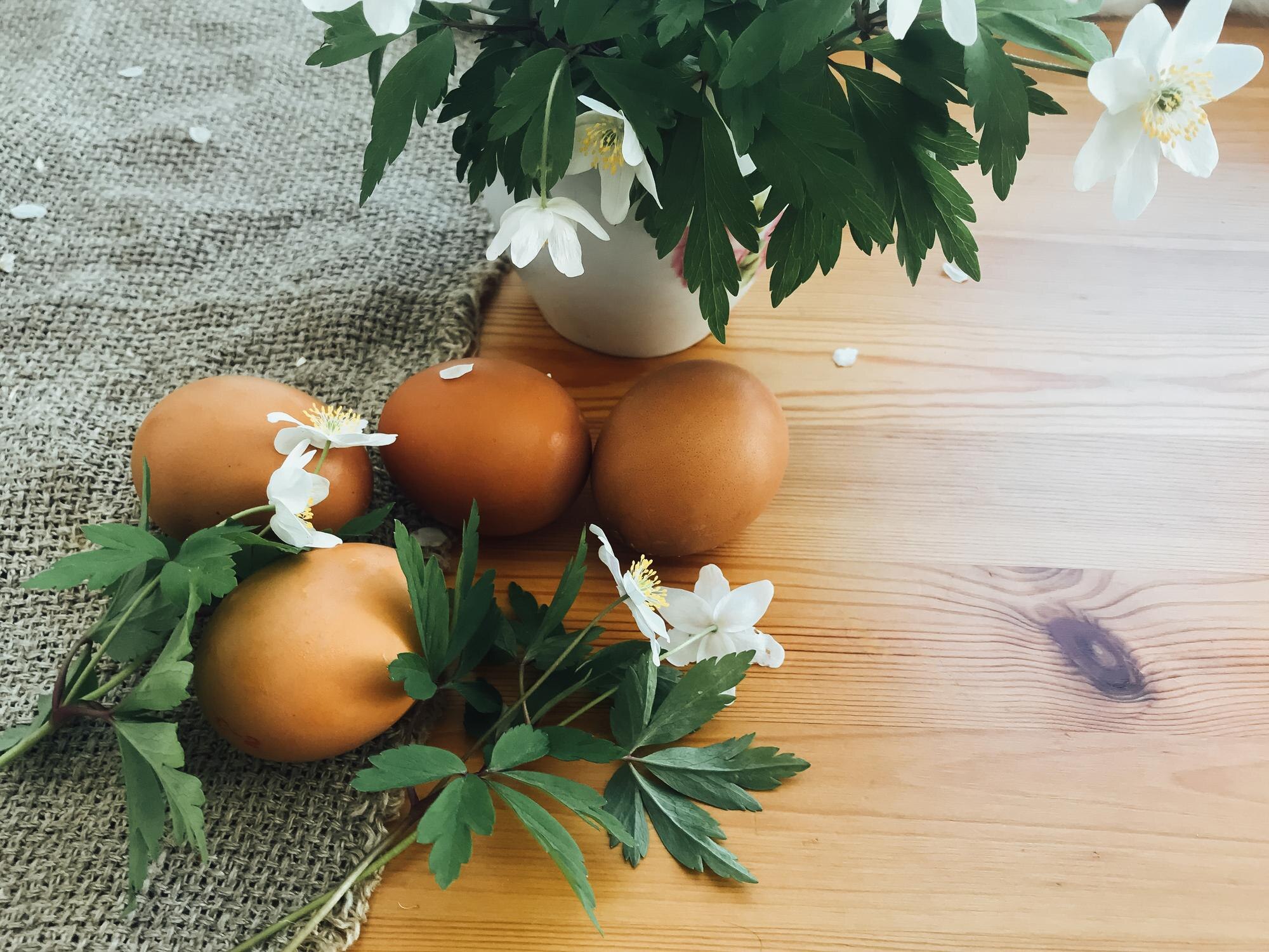 easter eggs with spring flowers on wooden rustic t 2c0696eee4b2b99d03bb