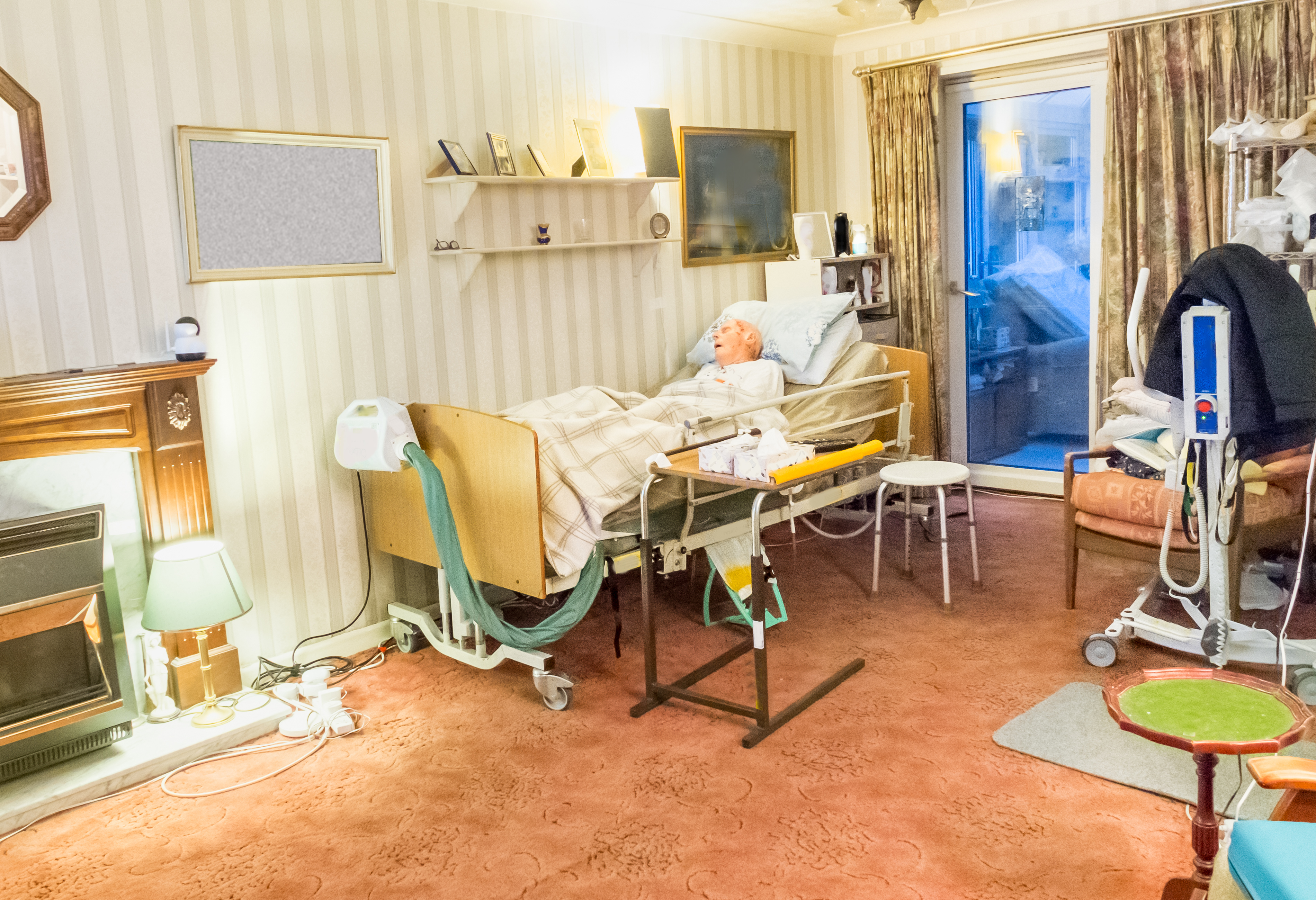 elderly frail bed ridden man at his home living ro a760f1c058de2ca24d88