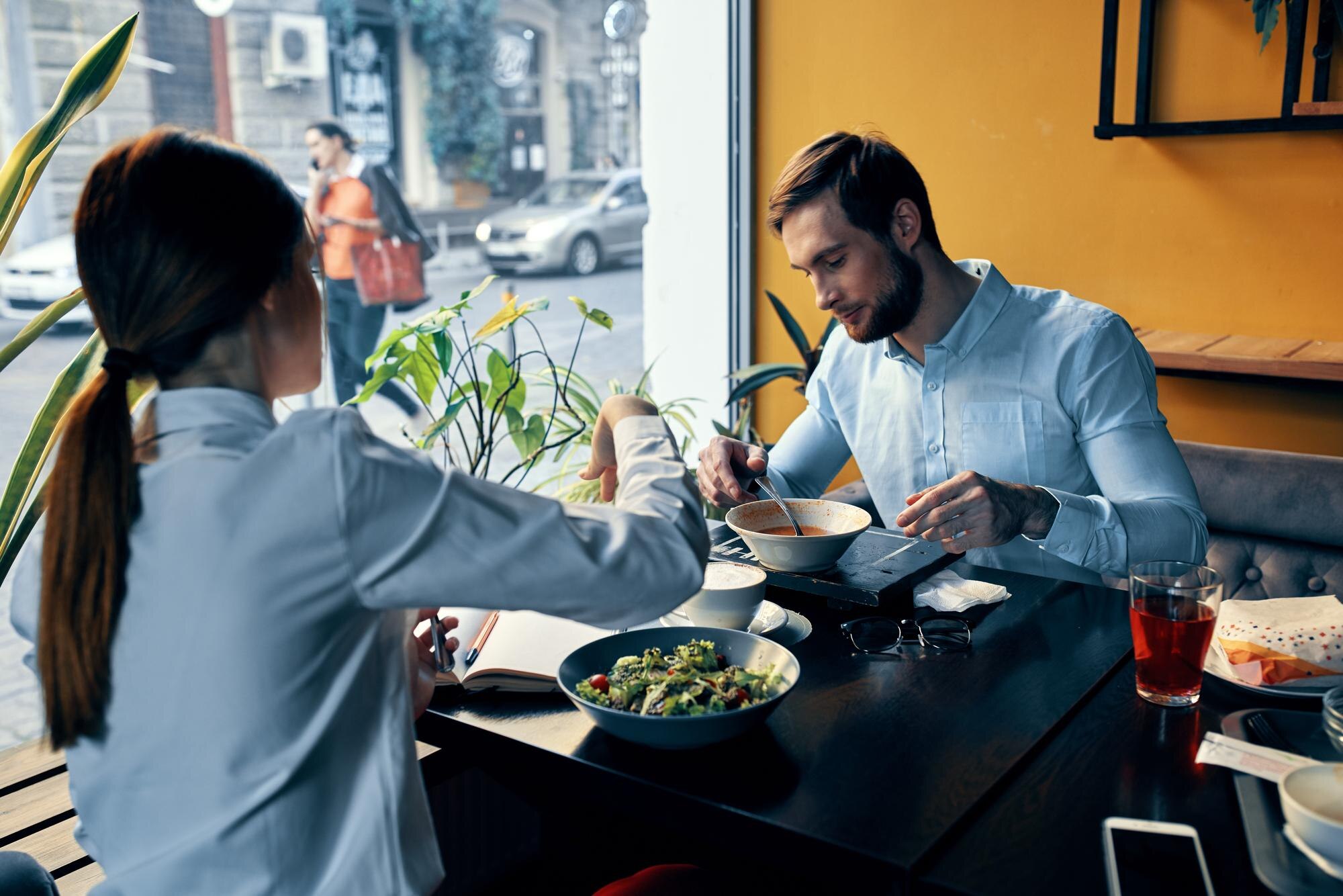 employees at the table in the cafe lunch break coo 318c32e0bbc53a220ecd
