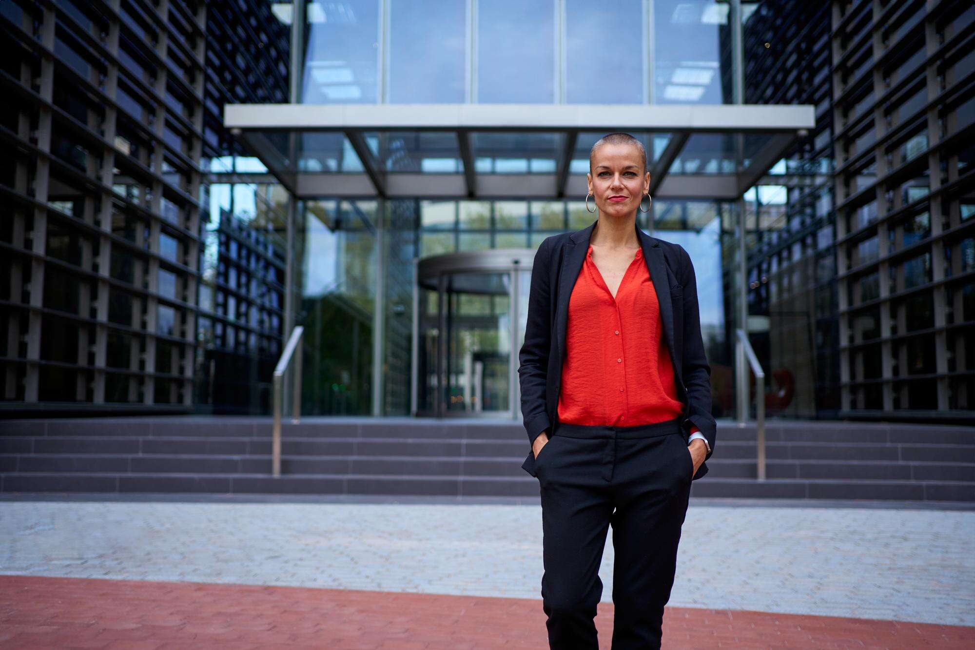 empowered adult business woman in suit posing stan e9a9f10aa5bd3a6d4dc1