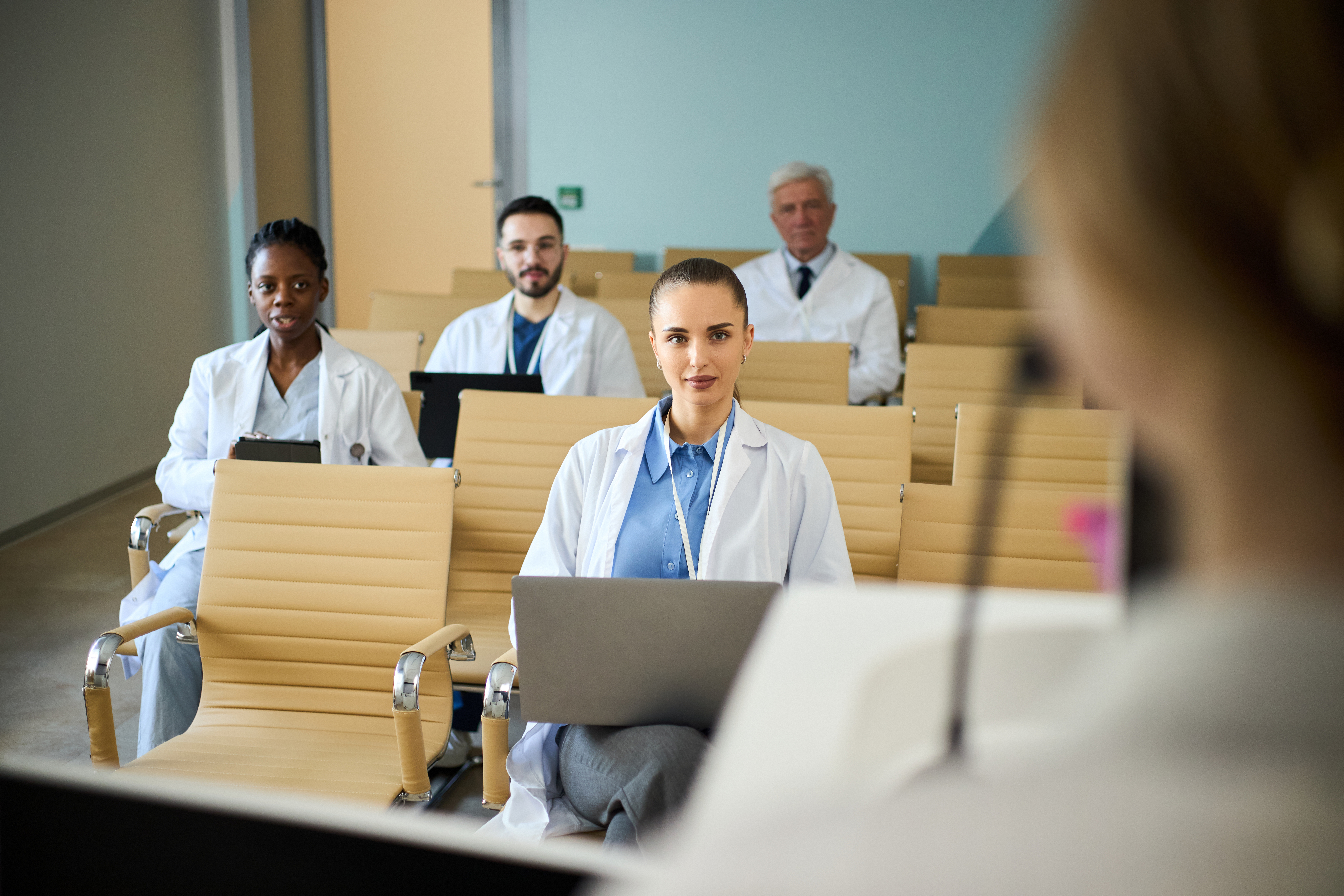 Unlocking Success: The Power Of Expert-Led Oet Preparation For International Medical Graduates 1 image of a lecture room of medical workers to illustrate OET preparation courses by Accordemy® - #The best OET preparation course