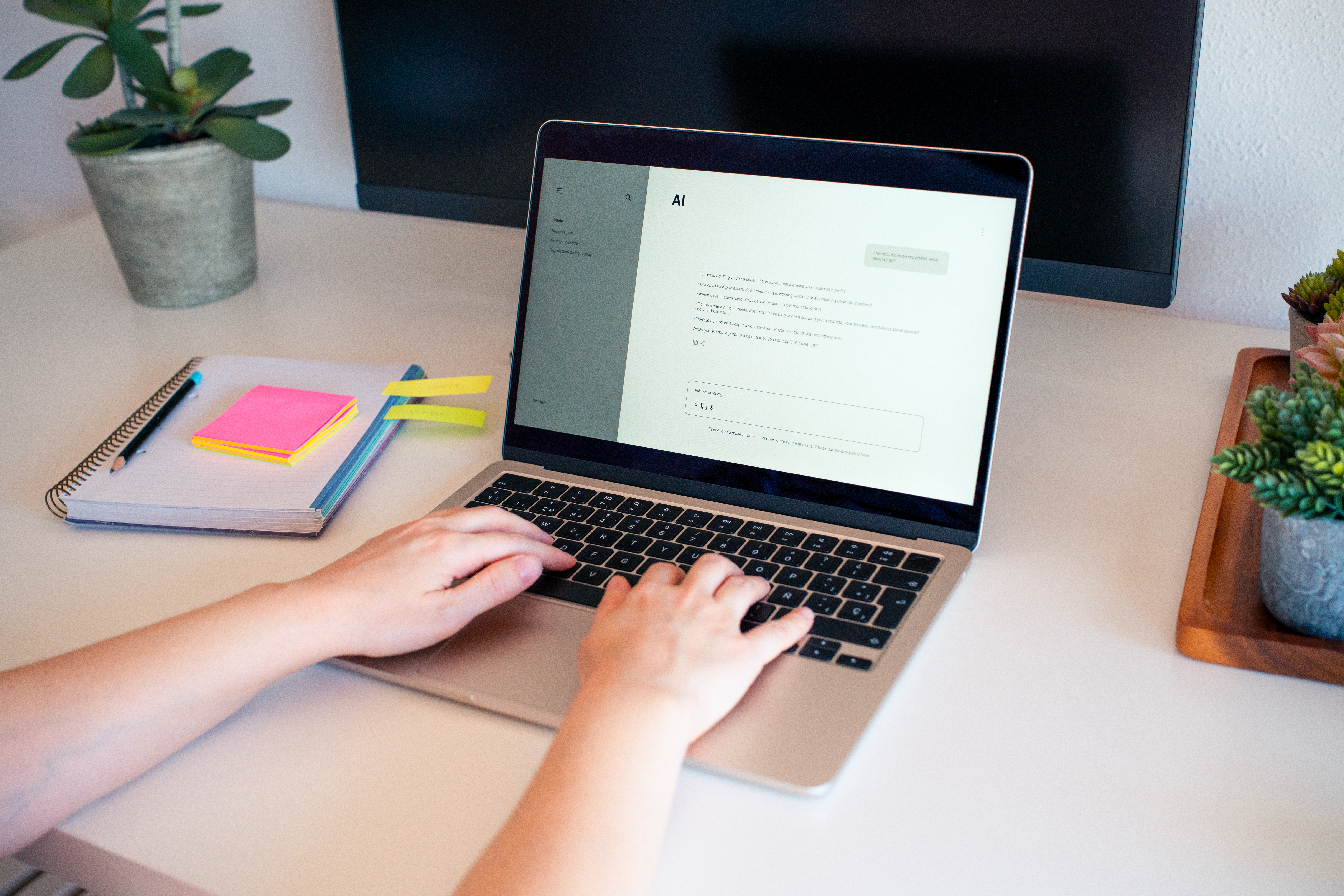 engaging with ai chatbot on a laptop at a modern w e66f6928f506e818a703