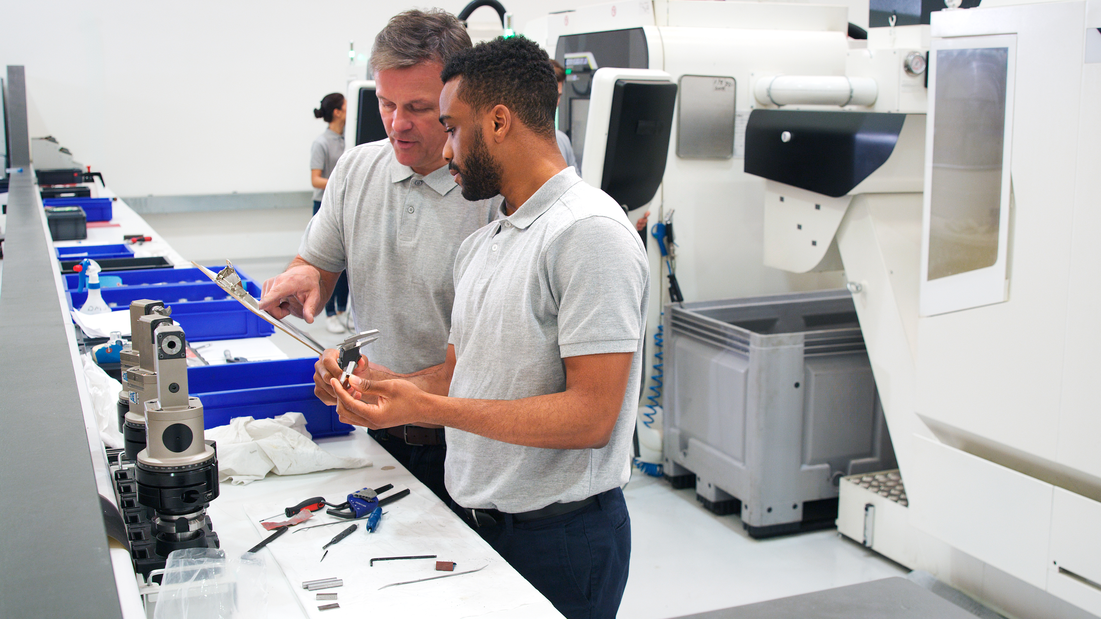 From Brief to Build: How Expert Advice and Support Drive Plastic Fabrication Success 2 engineer and male apprentice measuring components 4c6af9d6822b7c039cc7