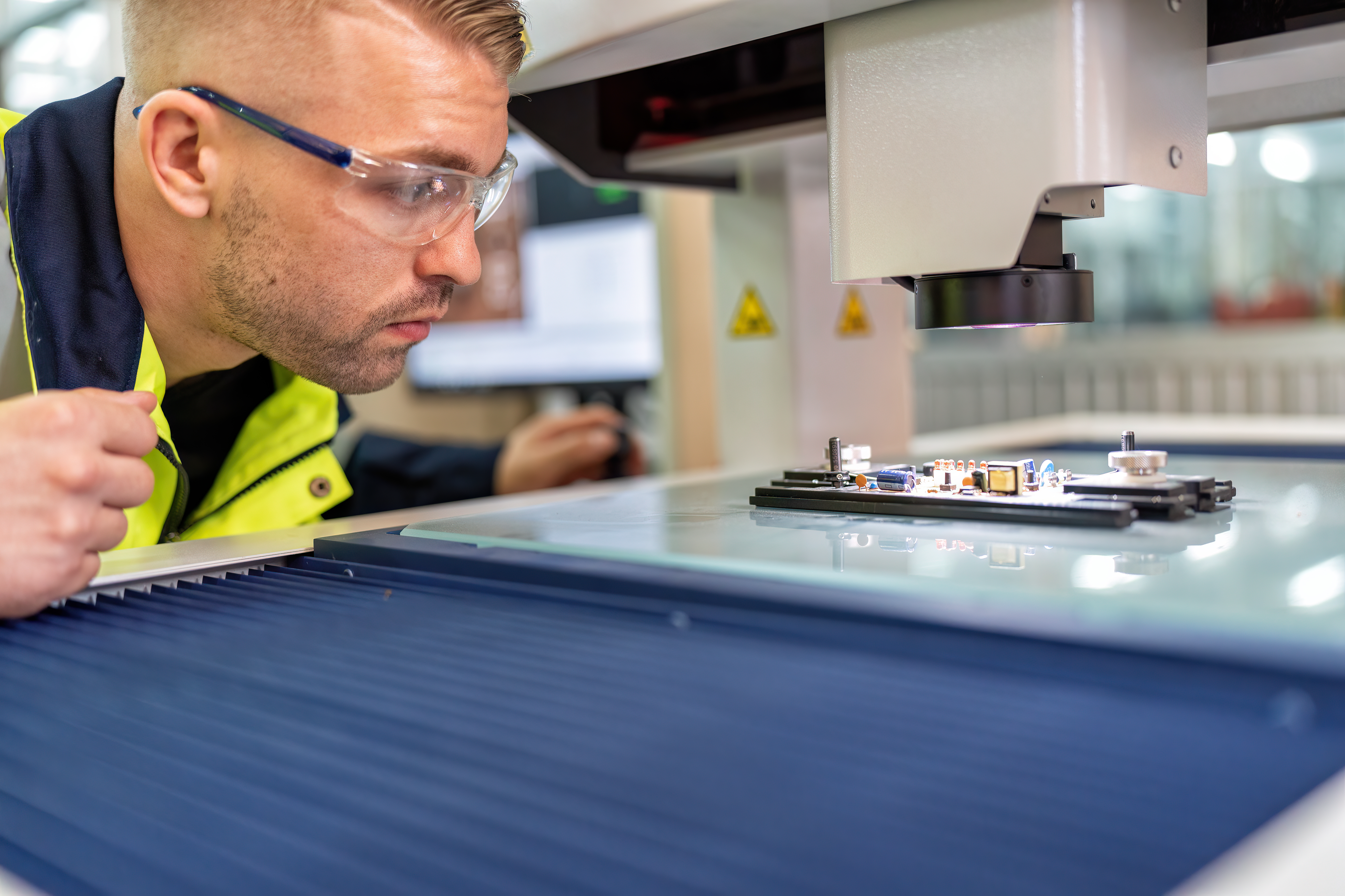 Made Here Matters: How Local Plastic Manufacturing Drives Sustainability and Innovation in Australia 3 engineer sitting in robot fabrication room use mea 144a4073c5365681dd61