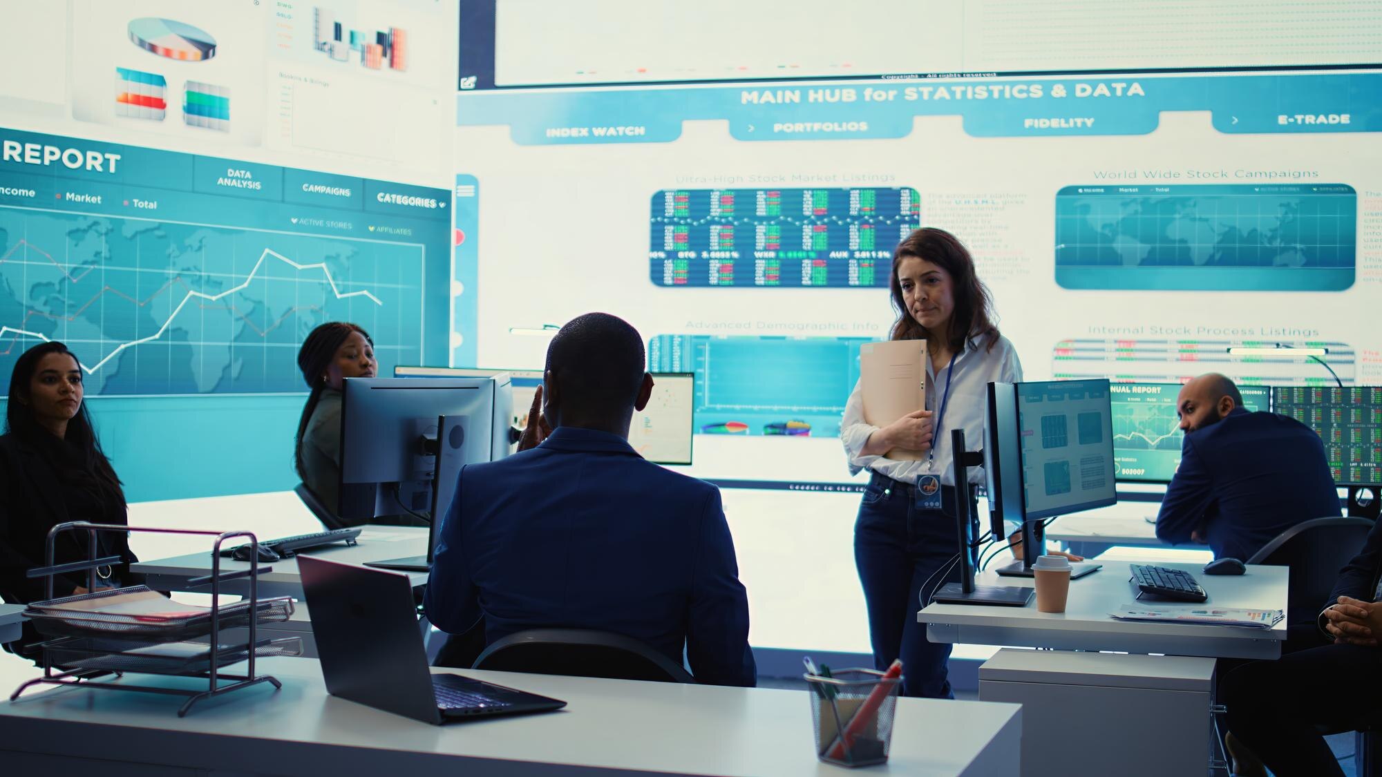 executive consultant gathers his staff to discuss b292a4427fd915757012