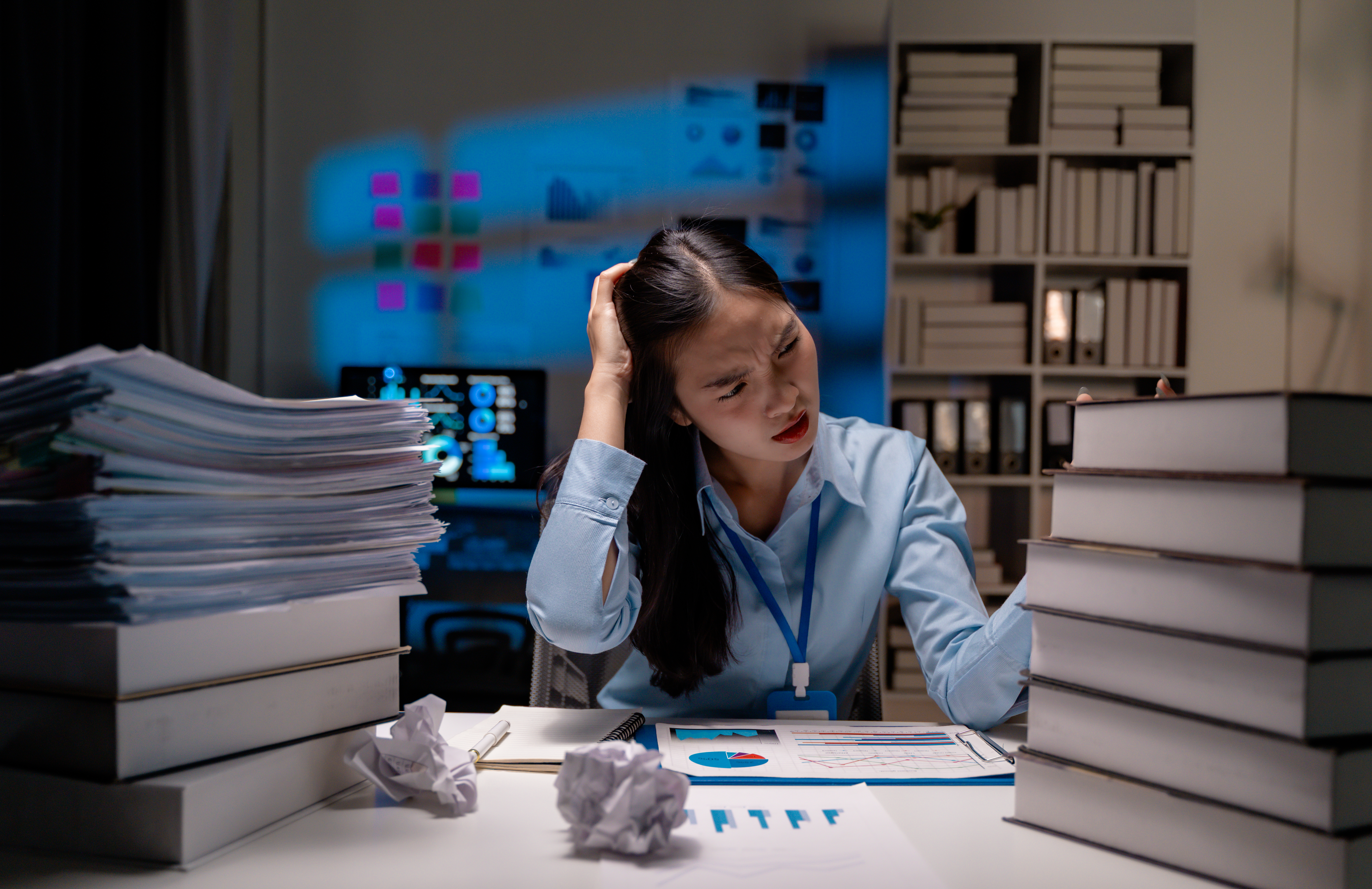 The Hidden Costs Of Chasing Productivity: Finding Balance In A Busy World 2 Exhausted Businesswoman Sitting At Desk Late At Ni 4C56F6D5C03705A95B86