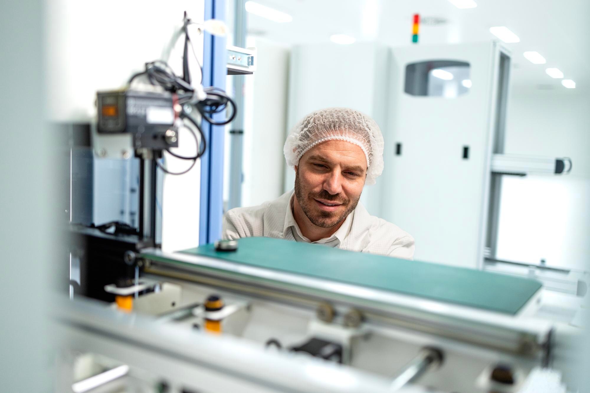 Why Local Plastic Production Delivers Better Quality and Faster Turnarounds in Australia 2 experienced engineer working on new automated robo b29ceaf194fa655e4475