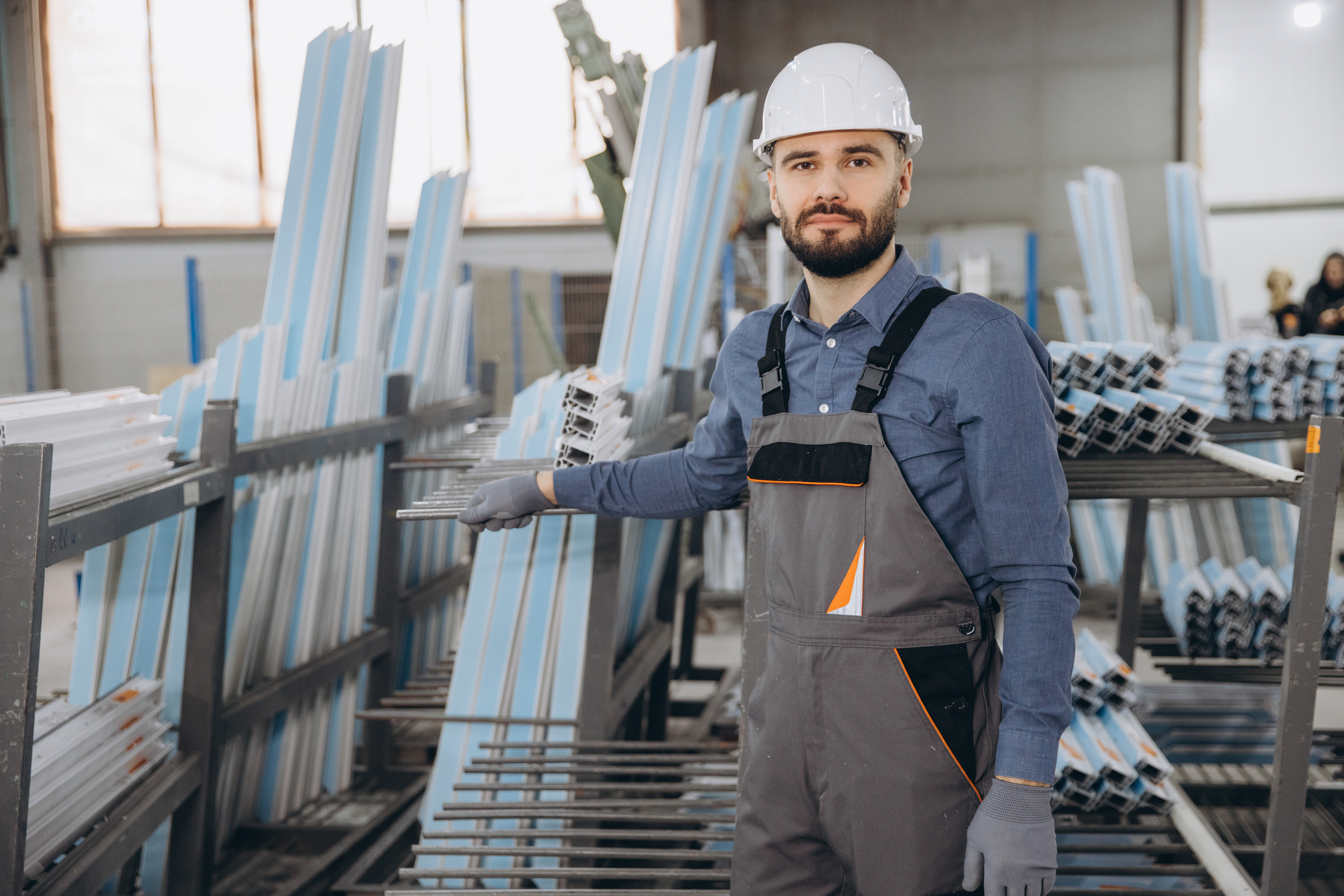 Why Local Manufacturing Delivers Better Plastic Quality and Faster Turnarounds 1 factory worker checking aluminum and pvc window an 51a85709fbd7133a4cb3