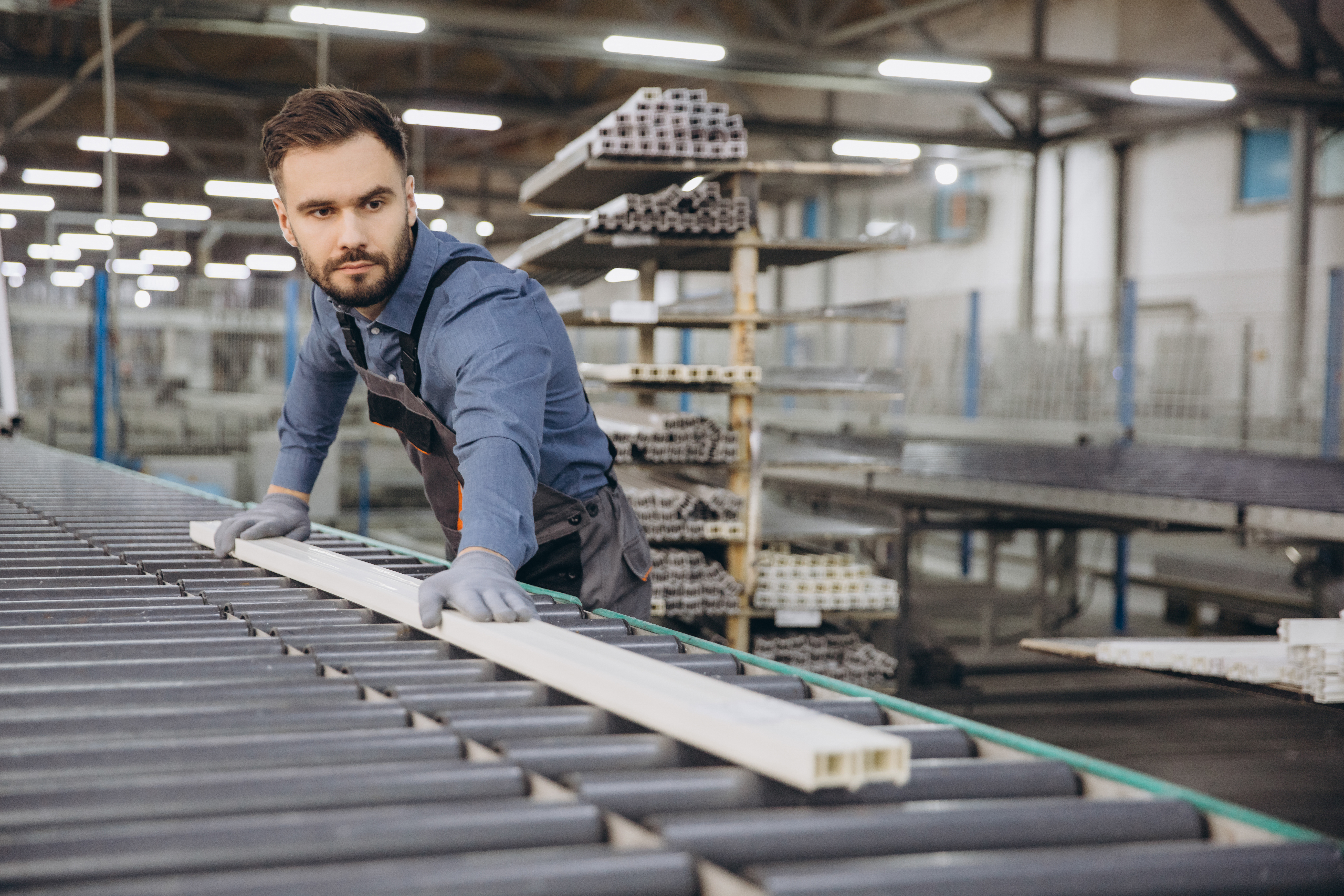 Top Fabrication Challenges for Tradies and DIY Enthusiasts — and How Plastics Solve Them 1 factory worker handling pvc window frame on produc 534151a572c04083baba