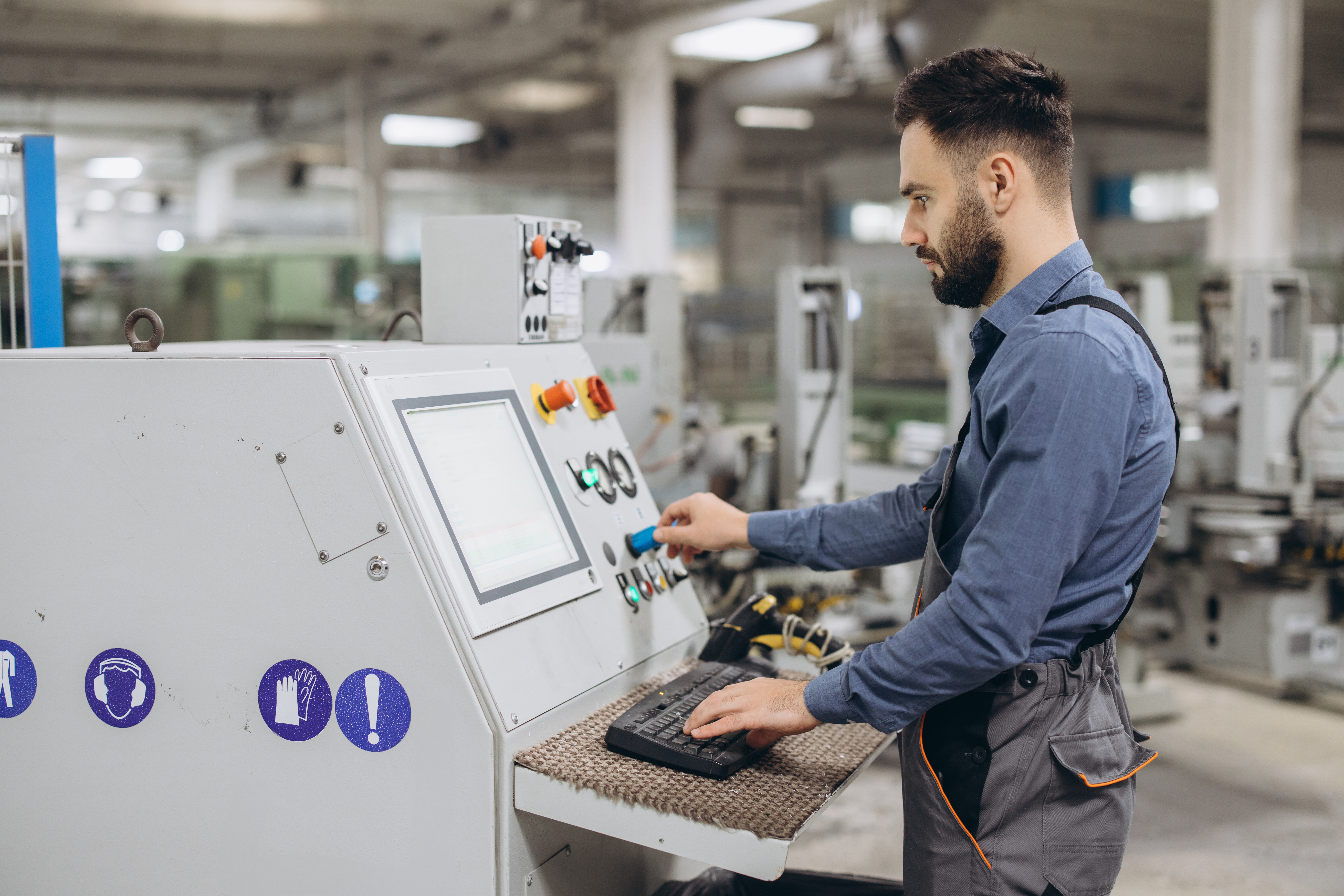 CNC Laser Cutting and Vacuum Forming: The Advantages That Power Smarter Plastic Projects 2 factory worker operating industrial machinery prod d6a9ffa466163ad65a97