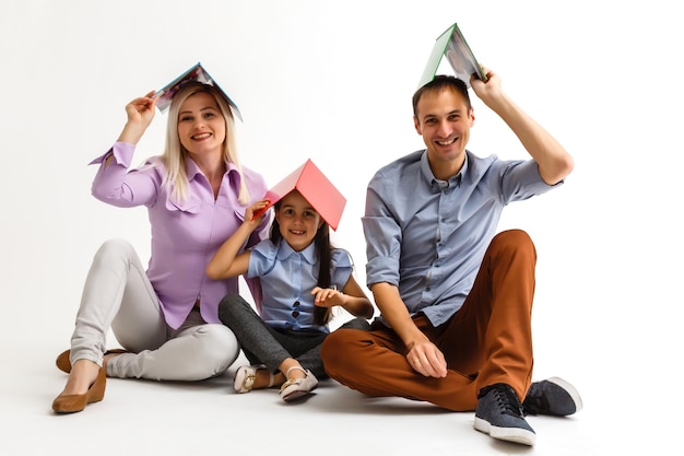 family reading book together lying floor home 493343 2258 aad7248cf95f90956a1e
