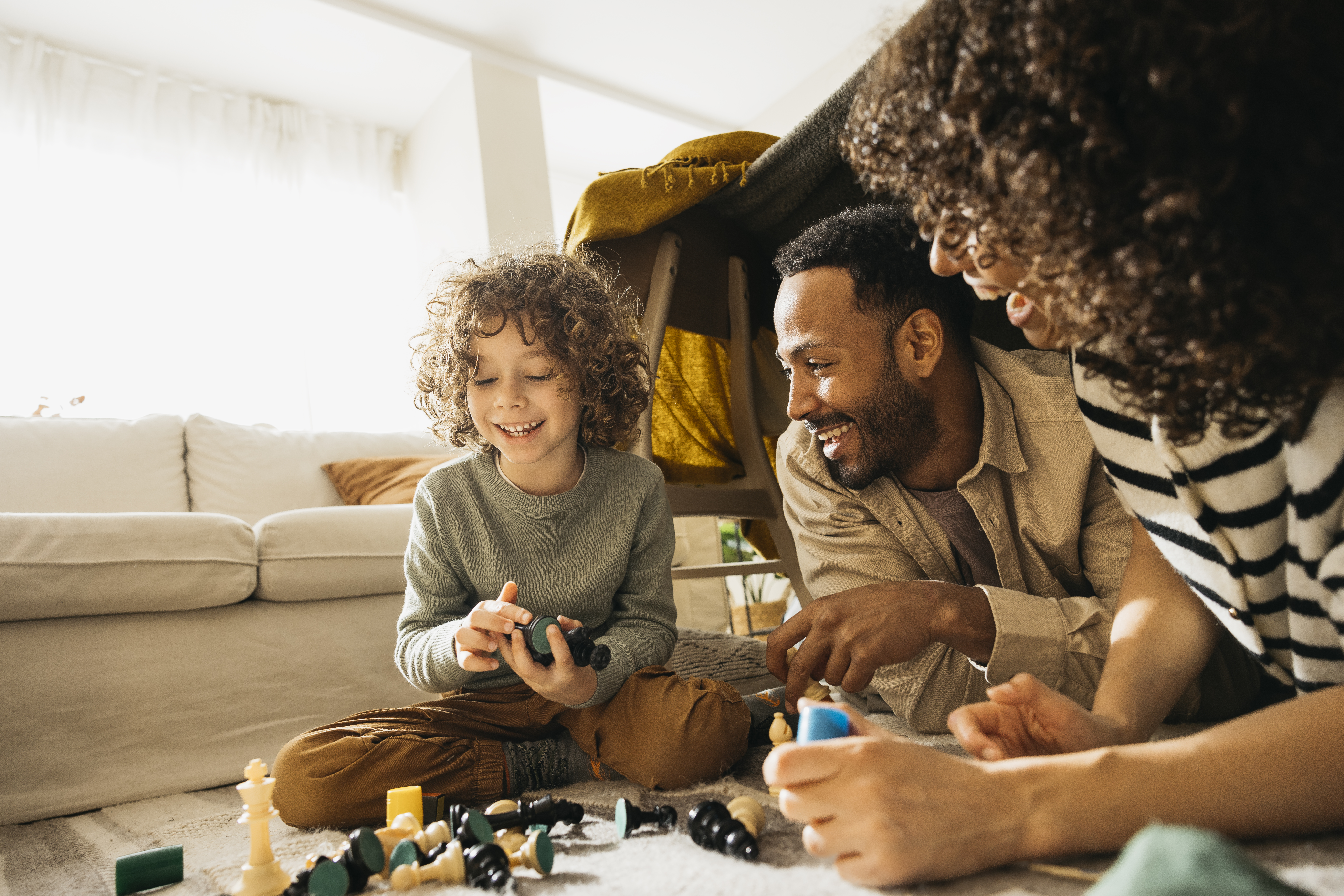 family enjoying quality time playing games togethe b522b56fd73ac3e2b9ae