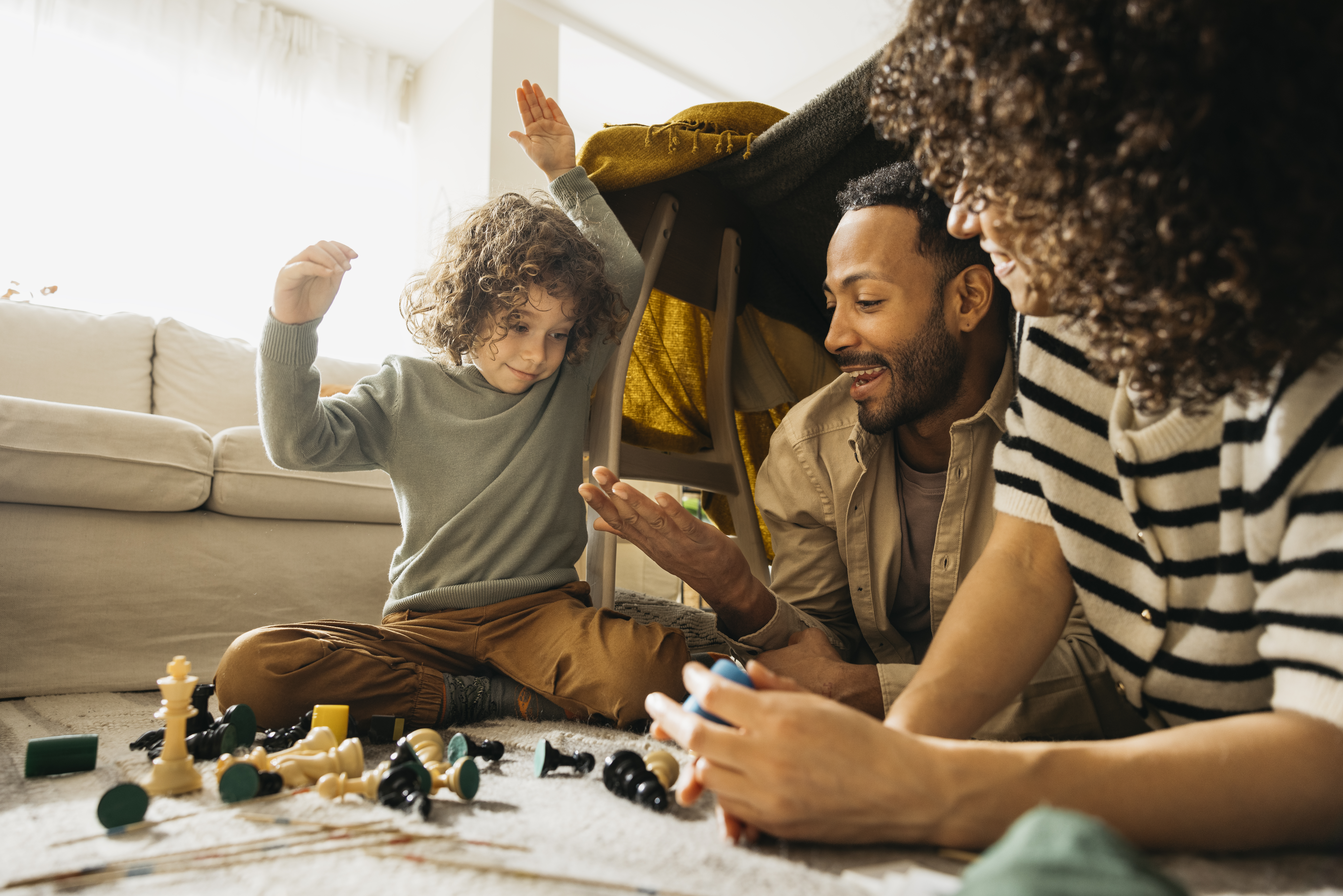 family enjoying time together playing games in a l 4baff1b8acae2a7783c2