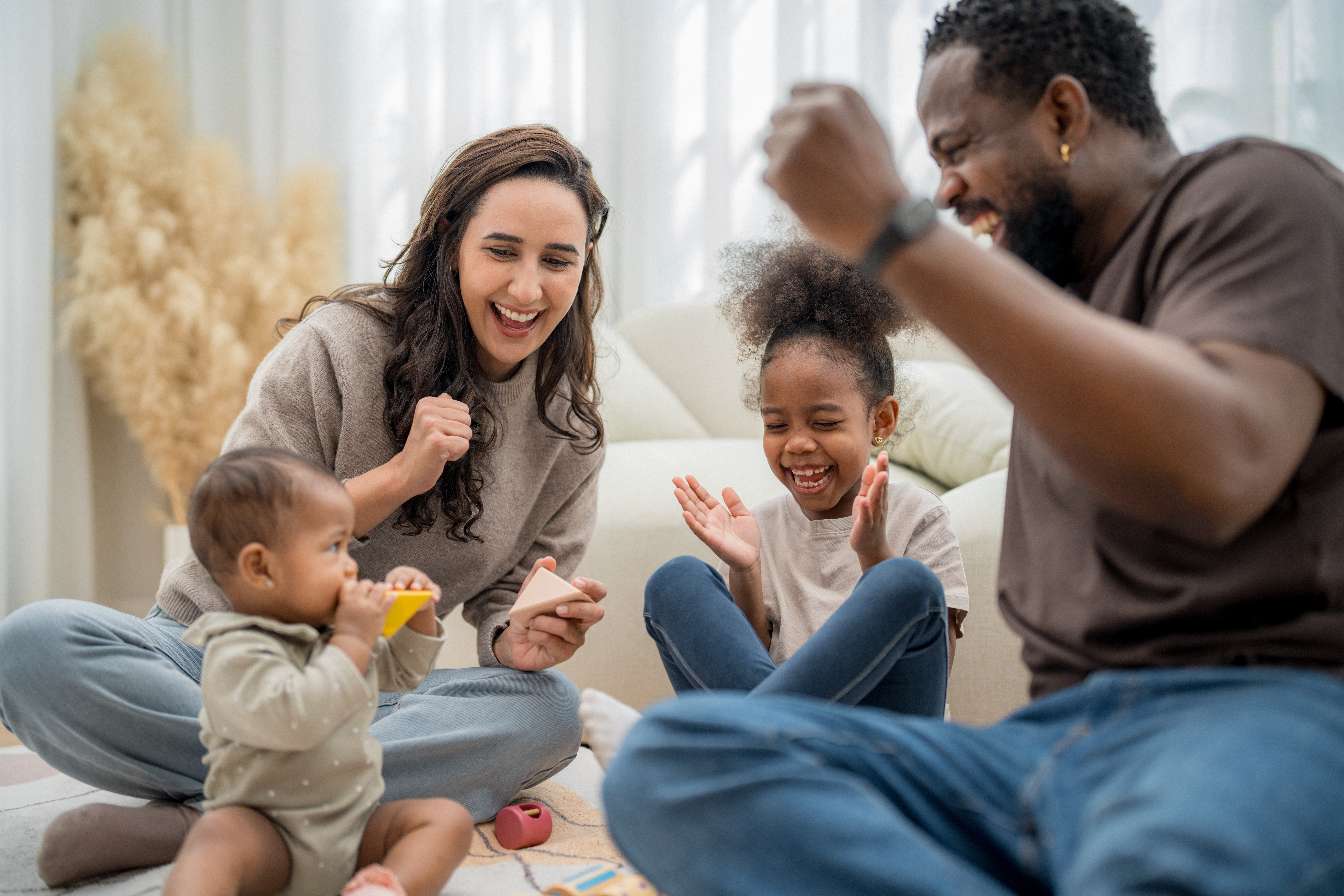 family enjoys playtime together indoors sharing l 918d4ce2931285566971