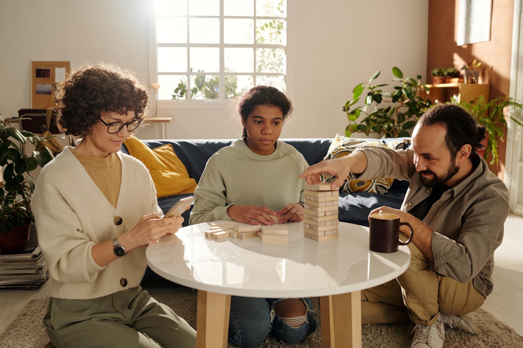 family playing board game at home 9fd4dfc1bc196418a9d9