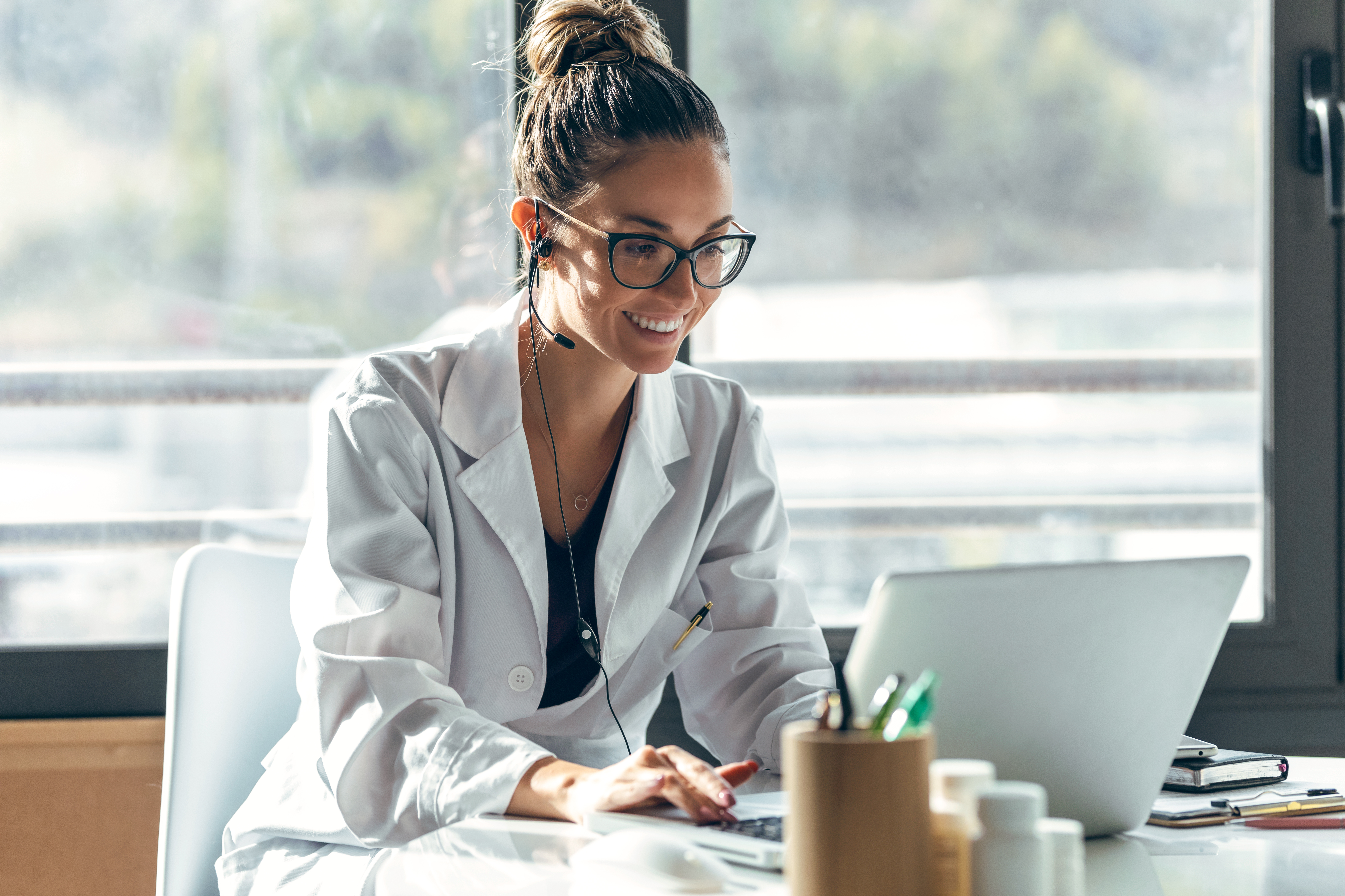 Master The Oet: Balancing Your Studies With A Busy Healthcare Career 2 image of a female healthcare worker in her office- #the best oet preparation course.