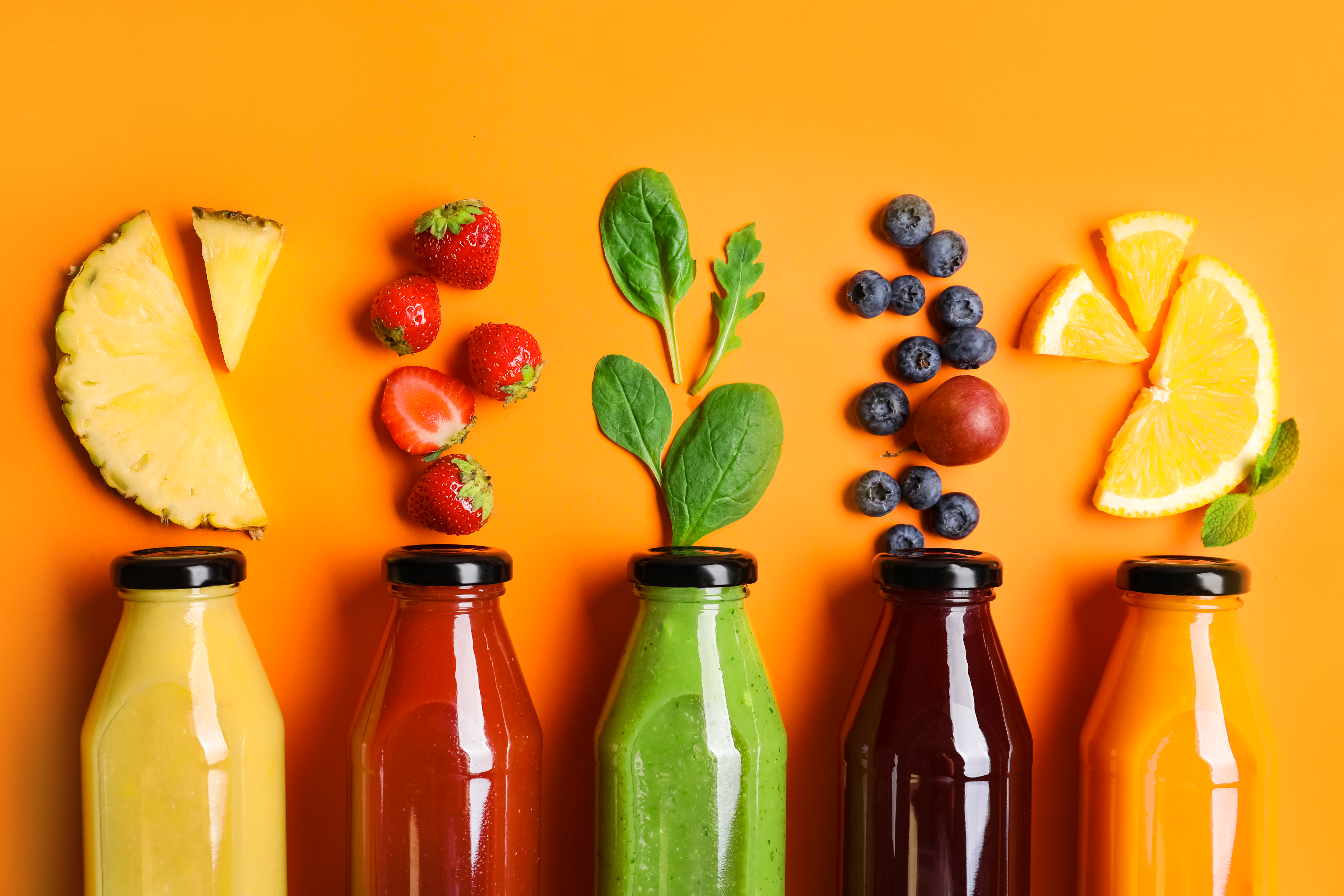 Fuel Your Active Lifestyle with Jubilee Juice & Grill's Protein-Packed Meals and Smoothies! 2 flat lay composition with bottles of delicious jui e592f46af04d6a49f9c2