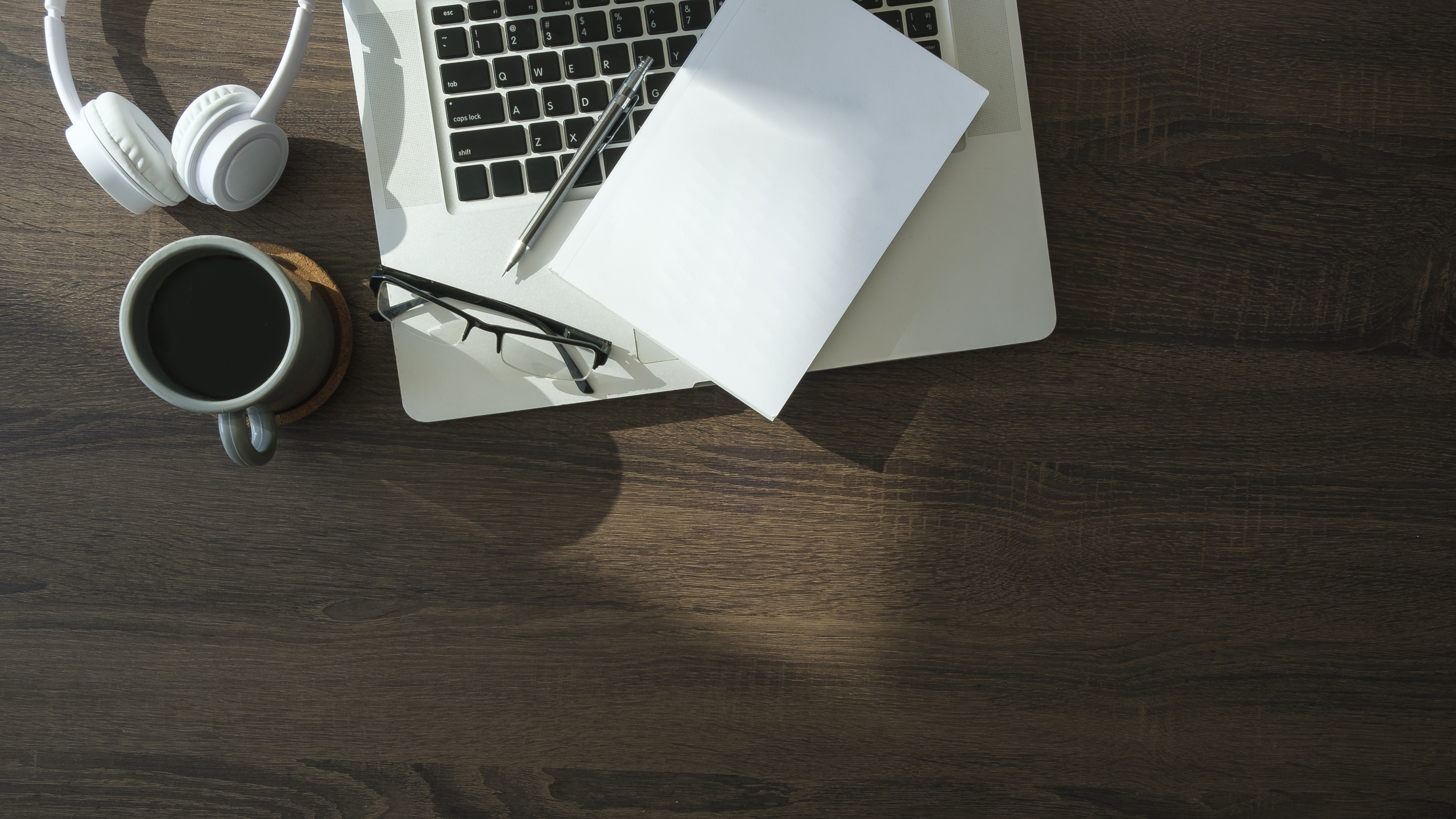 flat lay laptop computer coffee cup and stationer 60150d7b0a667874fbac