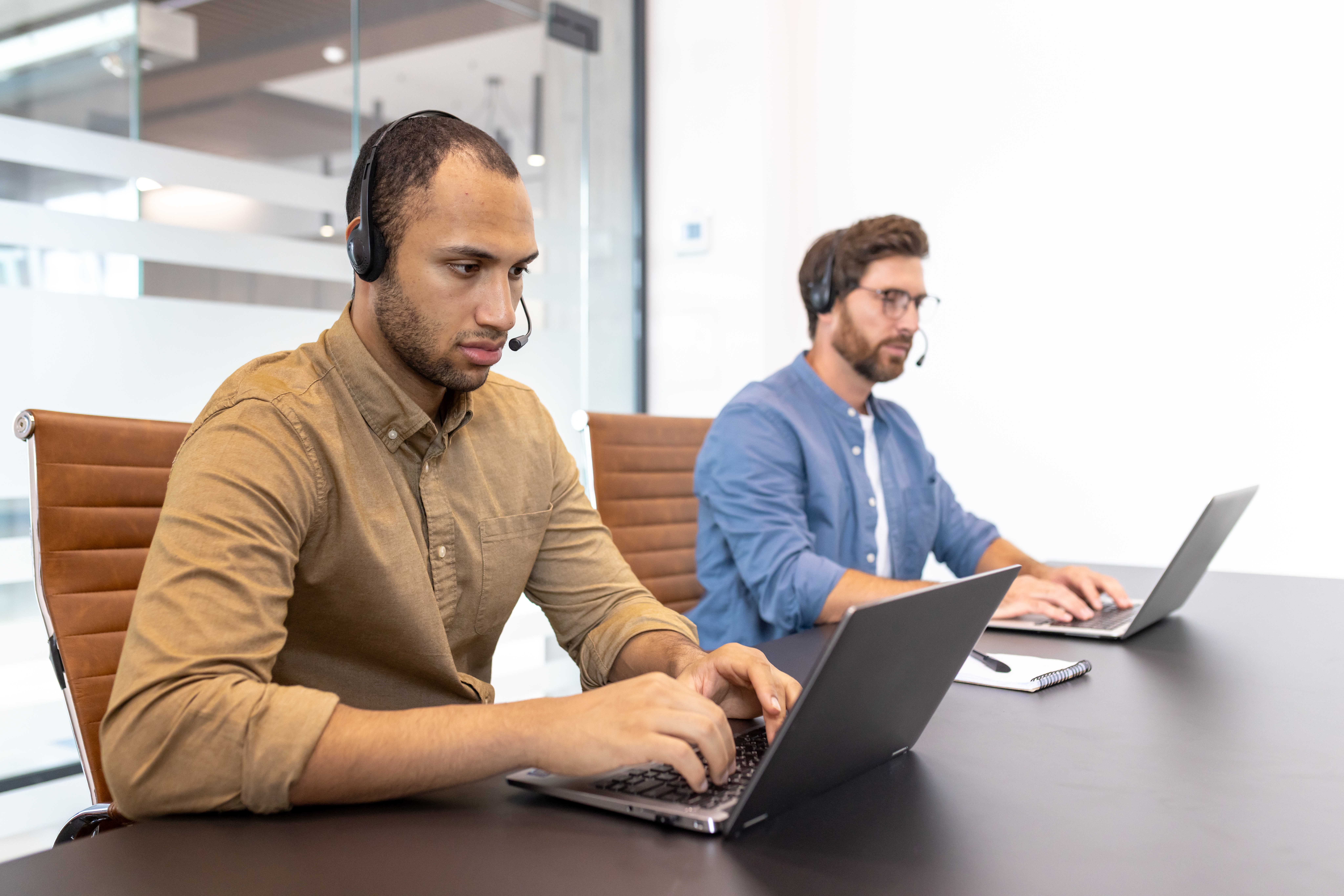 focused customer service representatives assisting 3a2c7005b189a788ba22