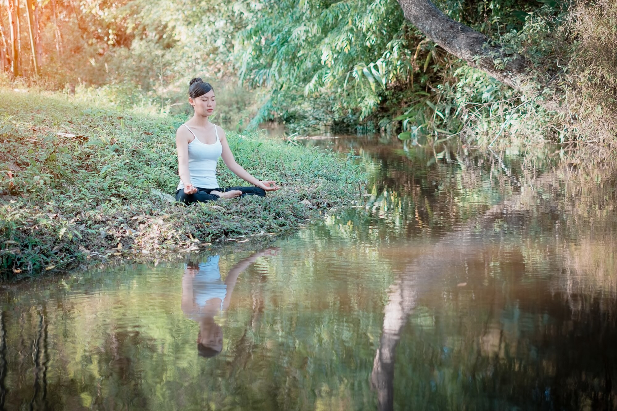 front view of woman meditating in a lotus yoga pos 5921fb7749c4ffe9bf14