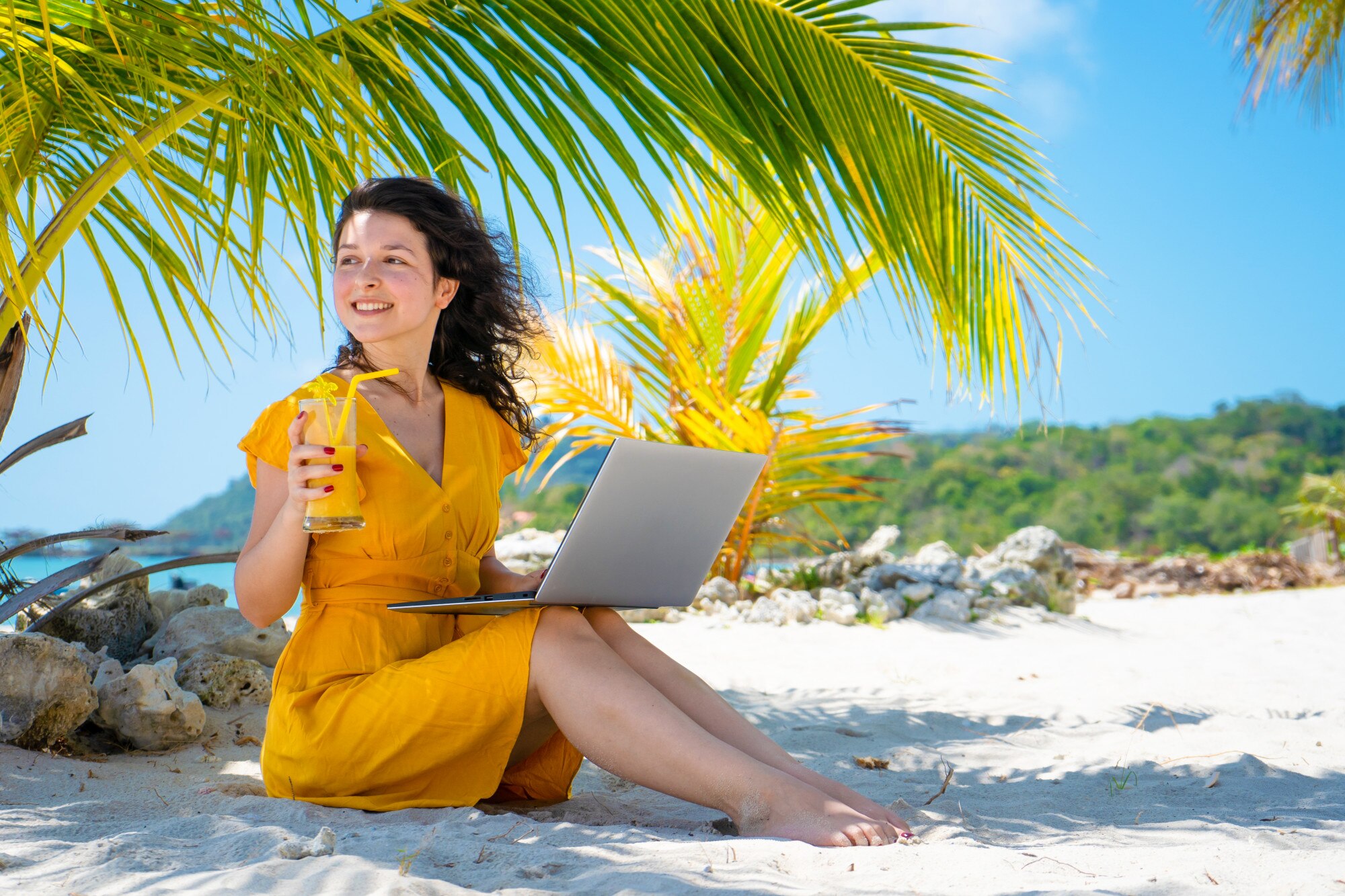 Unlocking Wellness: Travel Tips for the Busy Woman Entrepreneur 3 girl in a yellow dress on a tropical sandy beach w f33e6624b841ba64233a