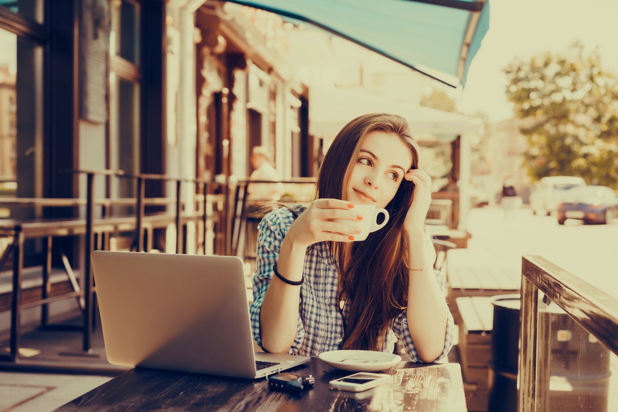 Unlock the World: Work-from-Anywhere Tips for Aspiring Travel Business Owners 2 girl looking at the street with a cup of coffee in 28be182704448c34ba46